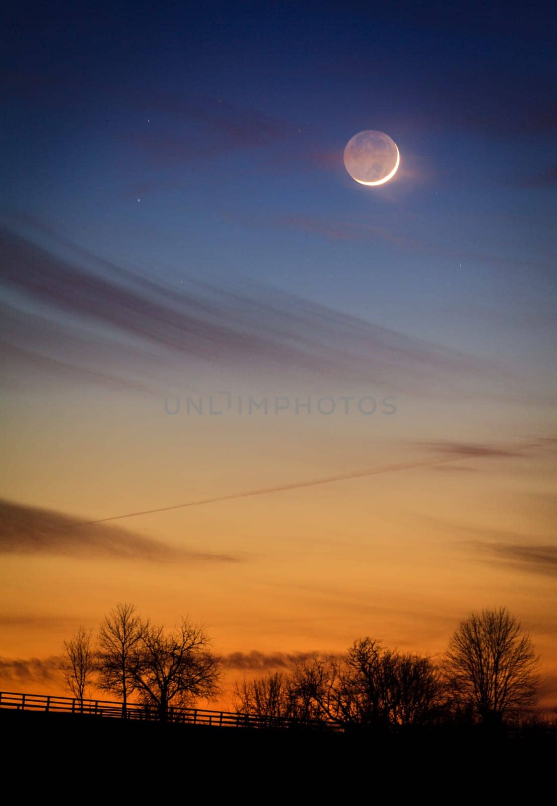 Scenic view of young crescent moon over rural Kentucky