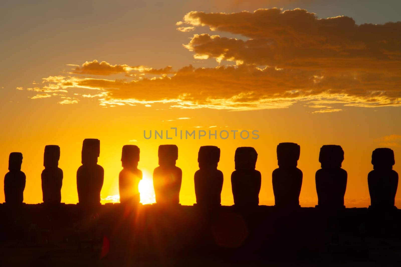 Dramatic colorful sunrise over Moai stone sculptures at Ahu Tongariki, Easter island, Chile