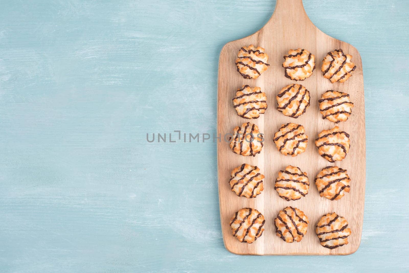 Coconut macaroons on a textured blue background