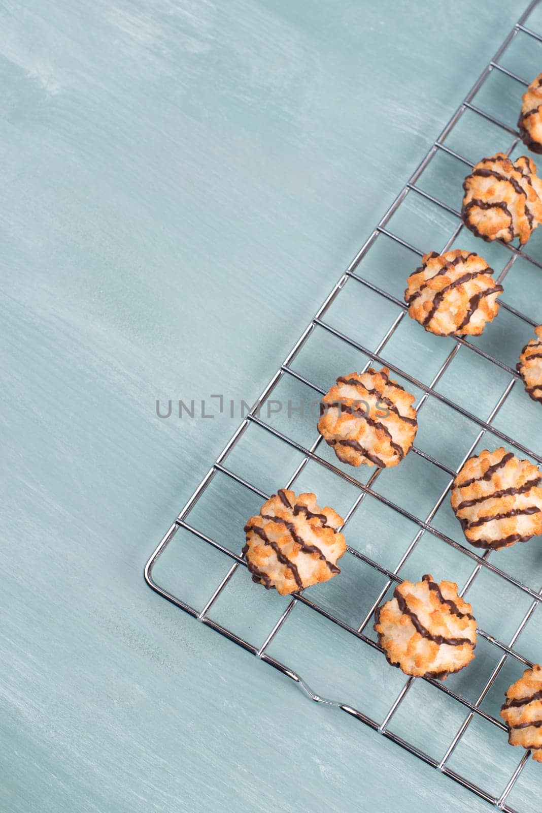 Coconut macaroons on a textured blue background
