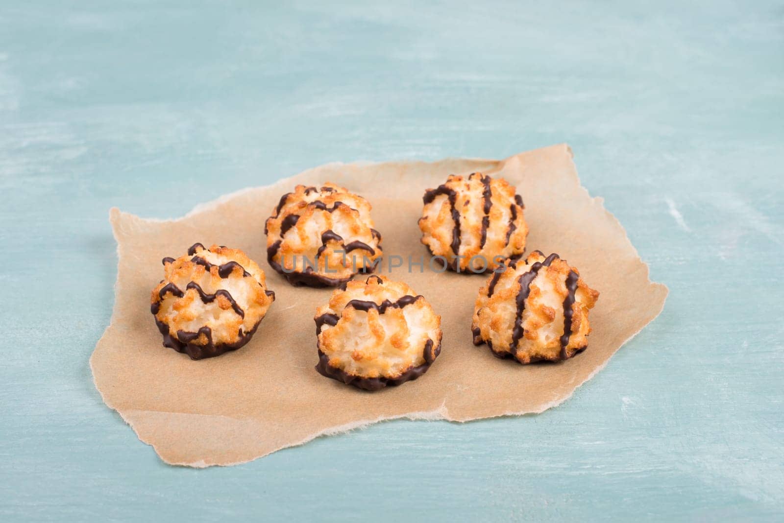 Coconut macaroons on a textured blue background