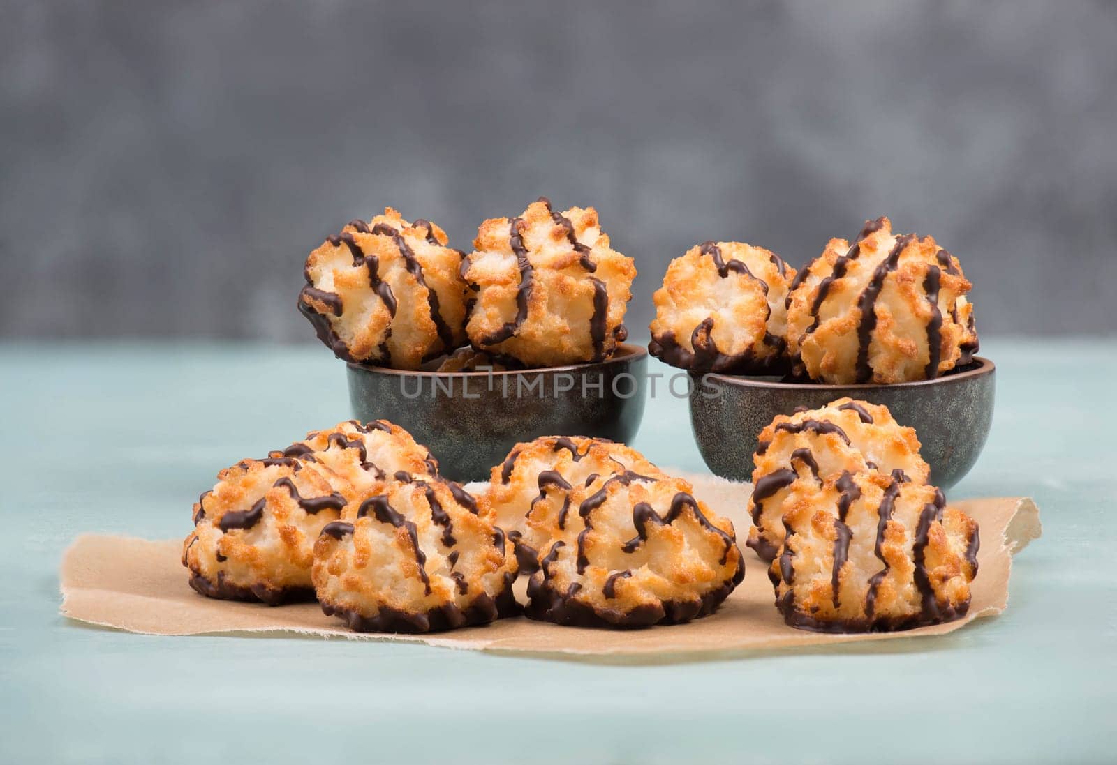 Coconut macaroons on a textured blue background
