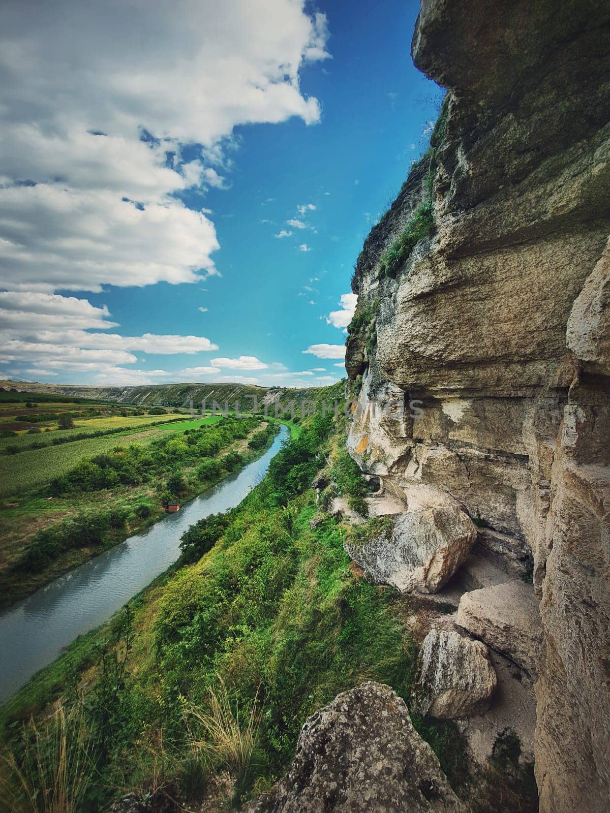 Idyllic landscape with Raut river flowing through the canyon hills, karst cliffs at Orheiul Vechi, old Orhei complex, near Butuceni village, Moldova.