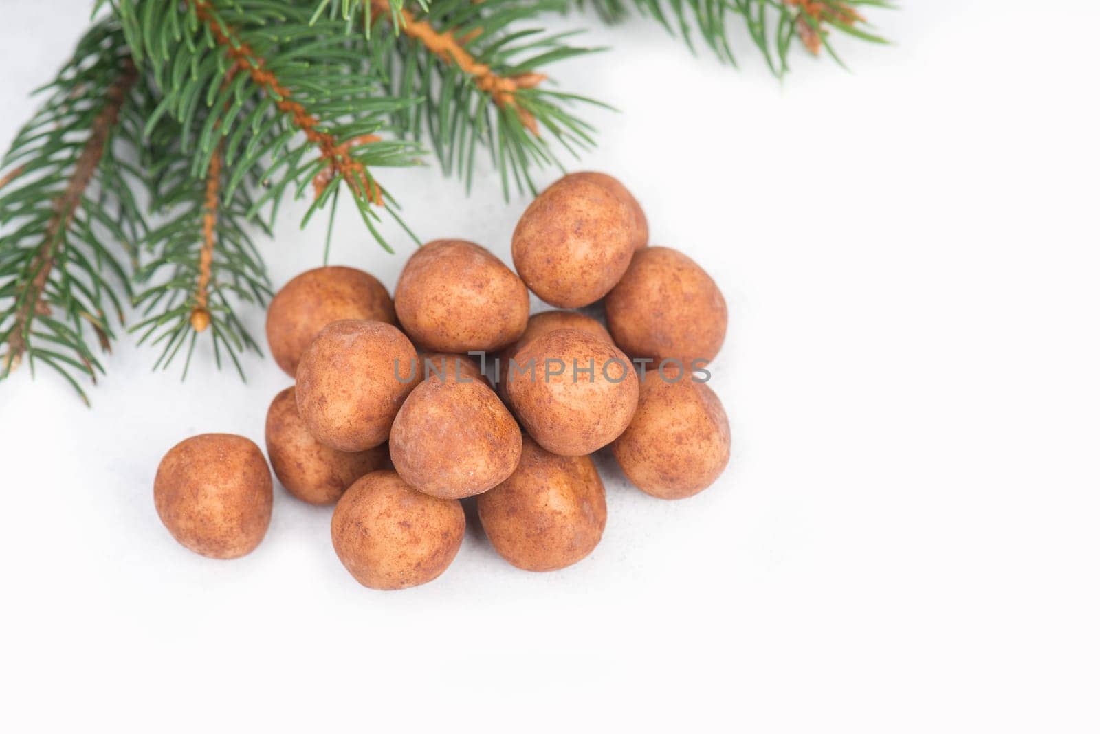 Marzipan potatoes, in german called Marzipankartoffeln, with cacao powder, sweets for christmas, empty copy space