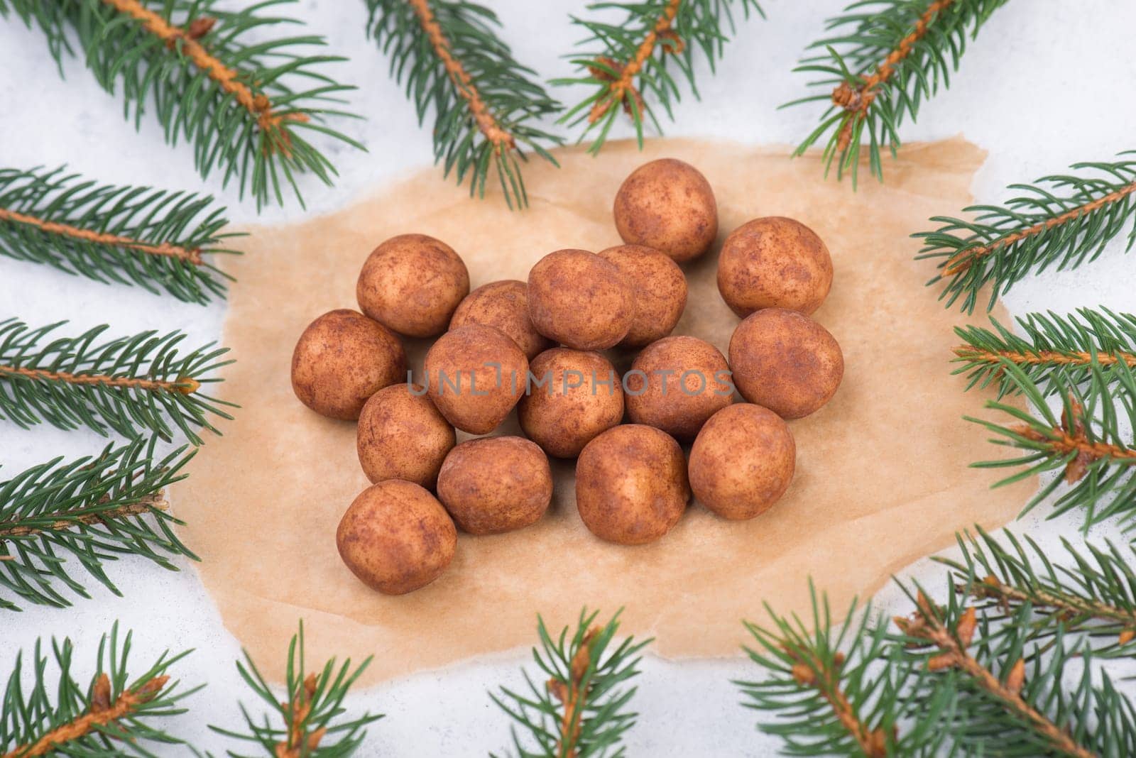 Marzipan potatoes, in german called Marzipankartoffeln, with cacao powder, sweets for christmas, empty copy space