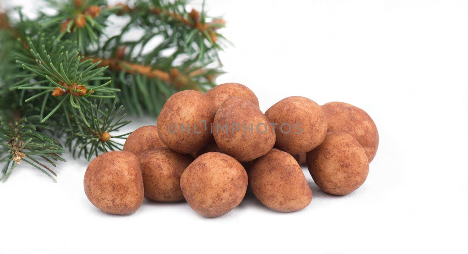 Marzipan potatoes, in german called Marzipankartoffeln, with cacao powder, sweets for christmas, empty copy space