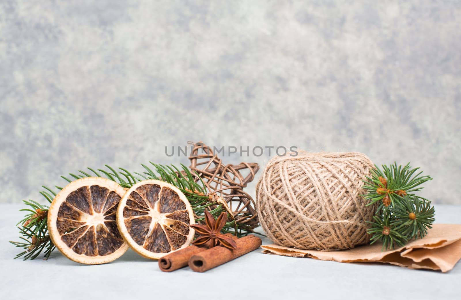 Christmas items like dried oranges, hazelnuts, fir branch, empty copy space