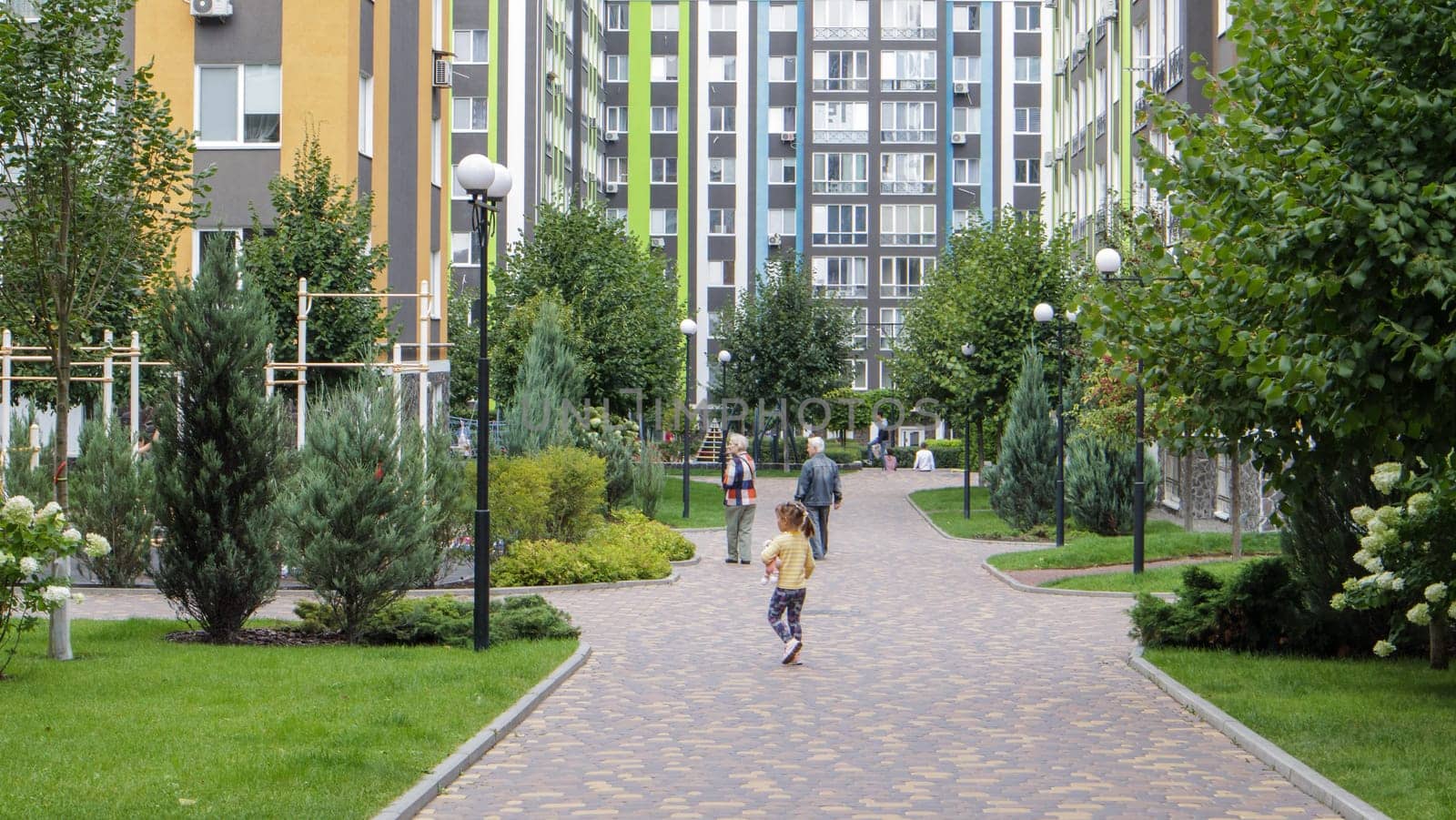 Apartment buildings in a new modern residential complex. Modern architecture. The territory of a residential area with multi-storey buildings and large landscaping. Ukraine, Kiev - September 13, 2021