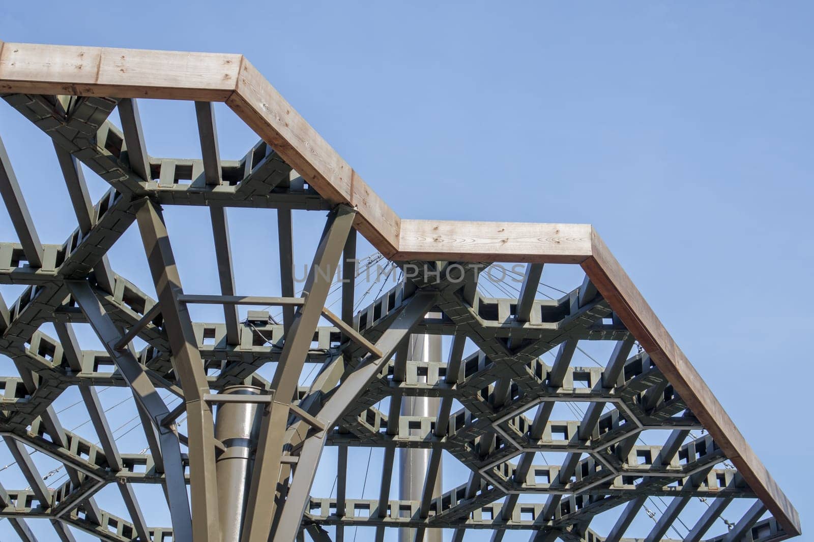 Pergola canopy, structural elements. An architectural structure of repeating arches to protect visitors from the sun. Renewed entrance lobby in Kiev on Trukhanov Island after reconstruction
