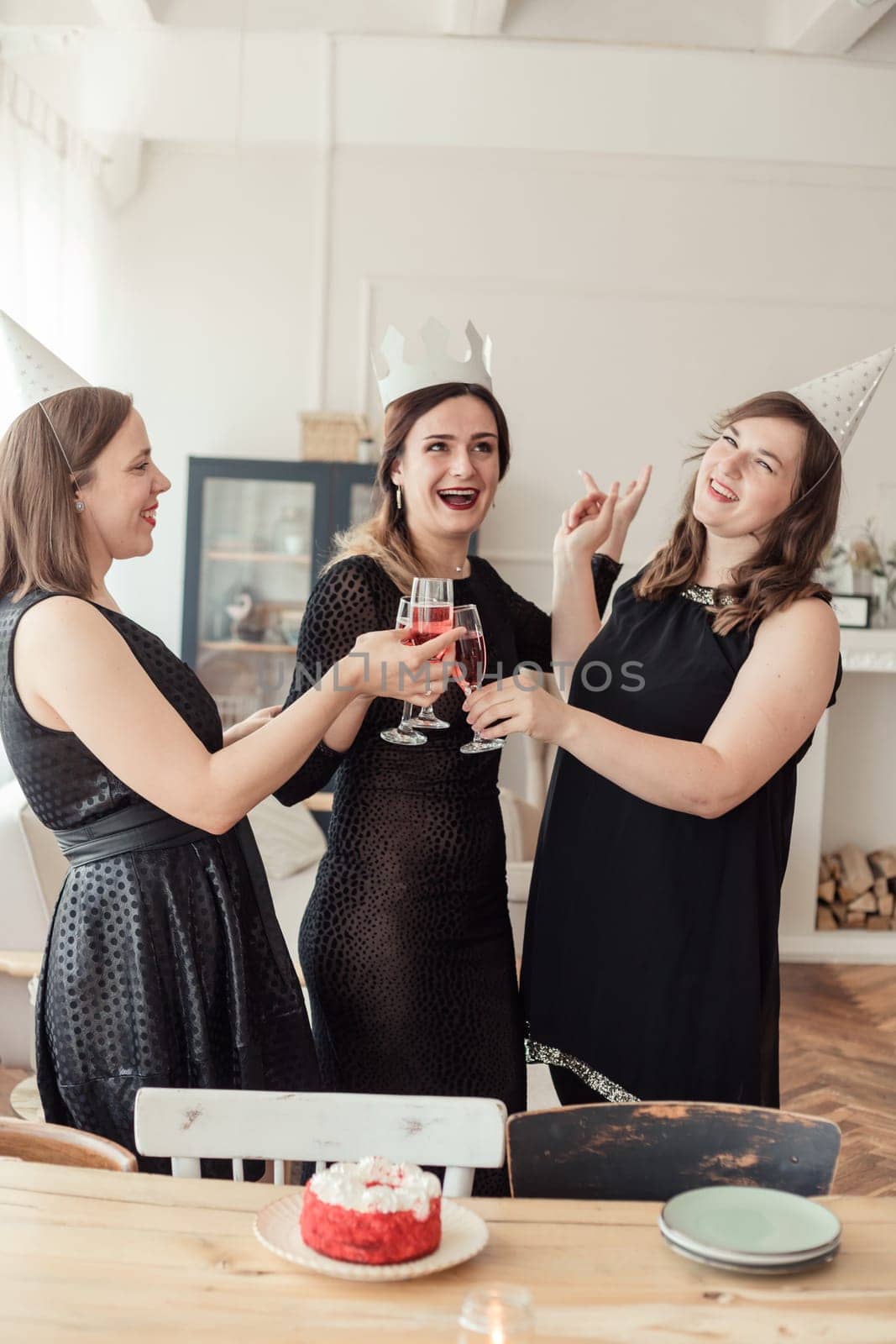 Celebration. Hands holding the glasses of champagne and wine making a toast.