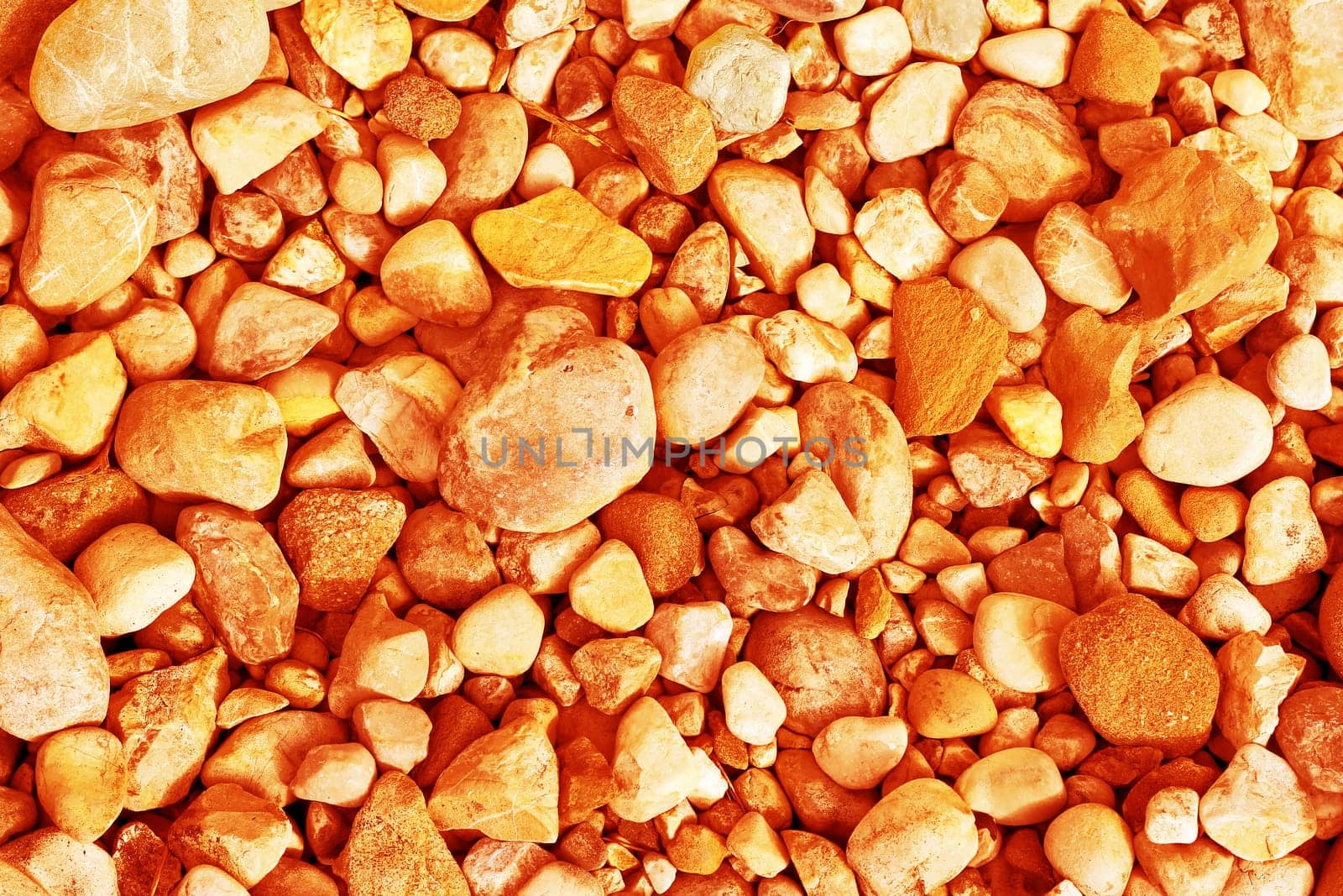 Many orange and yellow pebbles