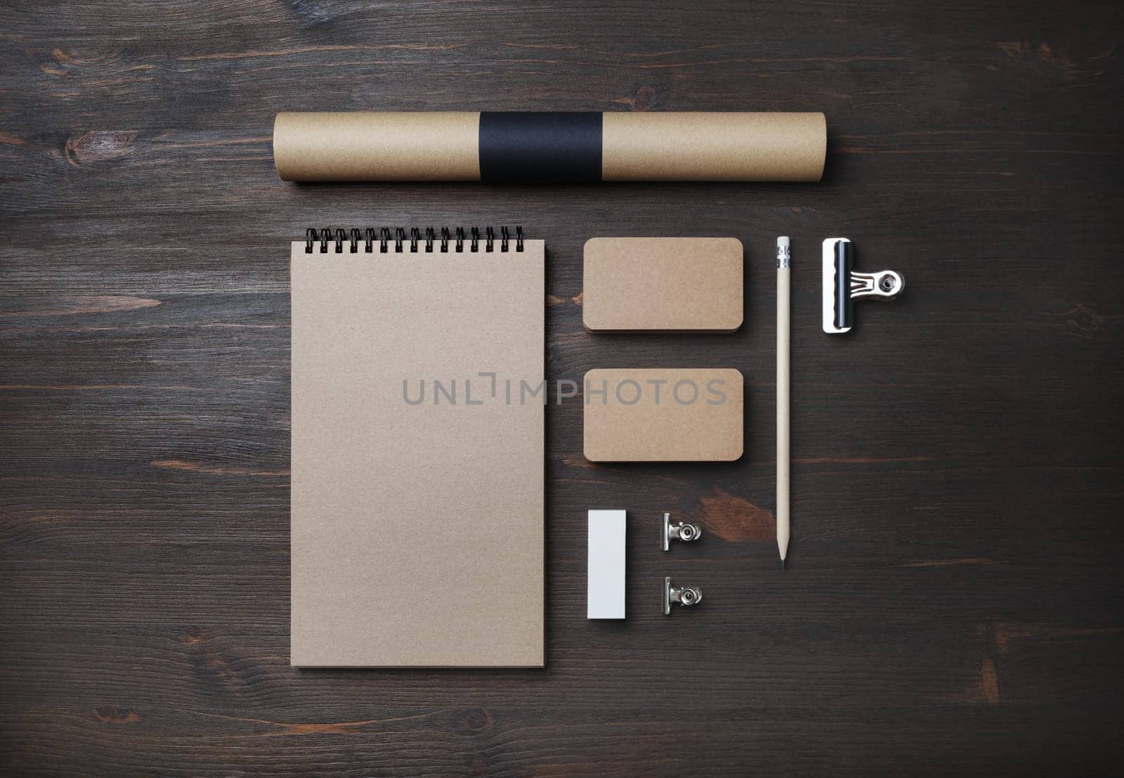 Blank kraft business stationery set. Corporate identity template on wooden background. Flat lay.