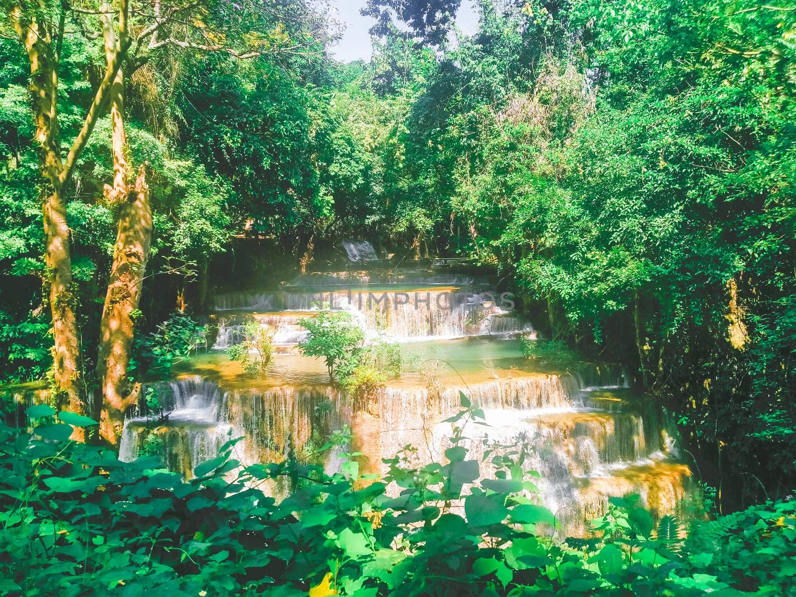 Huay Mae Khamin waterfall in Kanchanaburi, Thailand South east asia Jungle landscape with amazing turquoise water of cascade waterfall at deep tropical rain forest. travel landscape and destinations