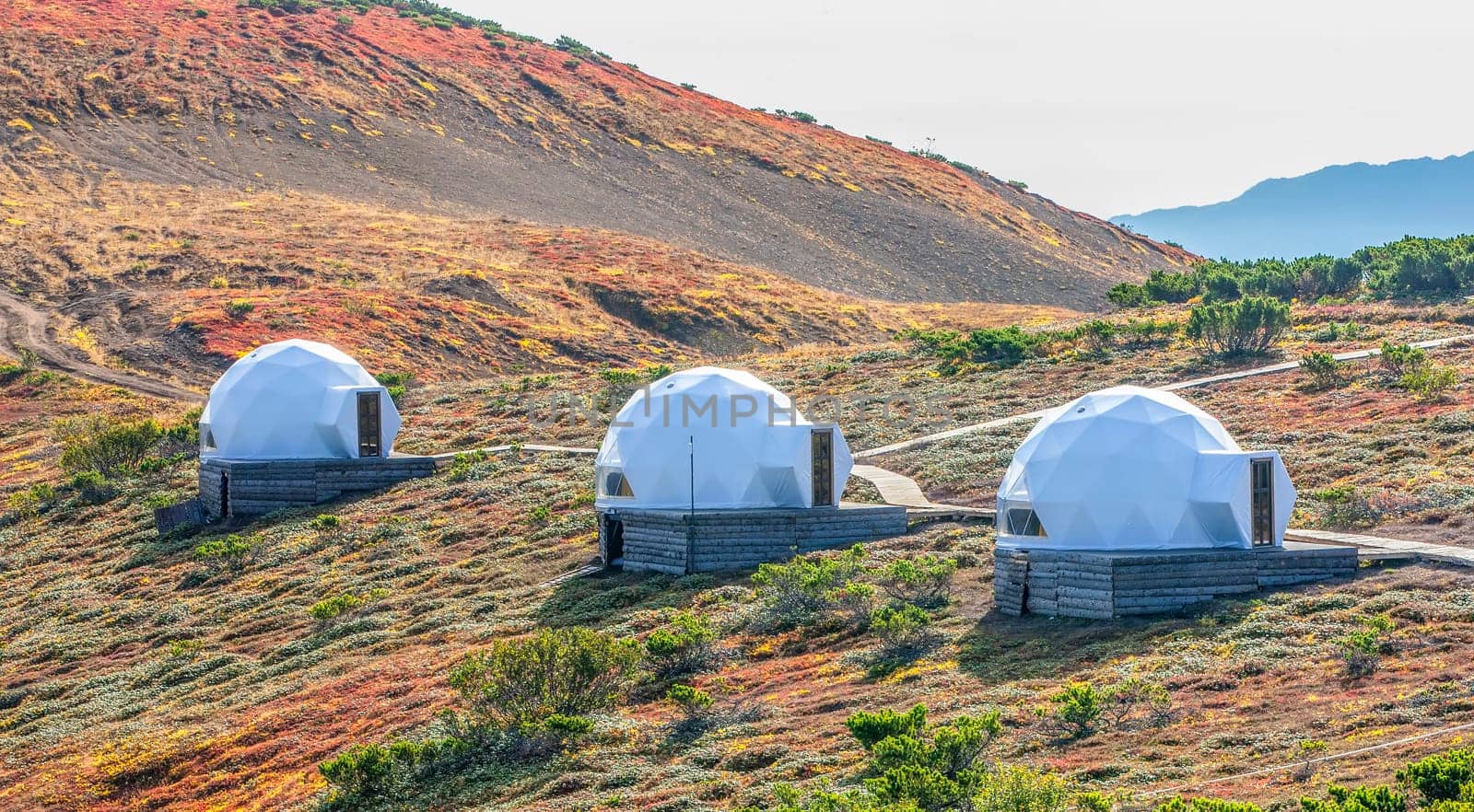 The White glamping on the slope of a volcano in autumn on the Kamchatka Peninsula