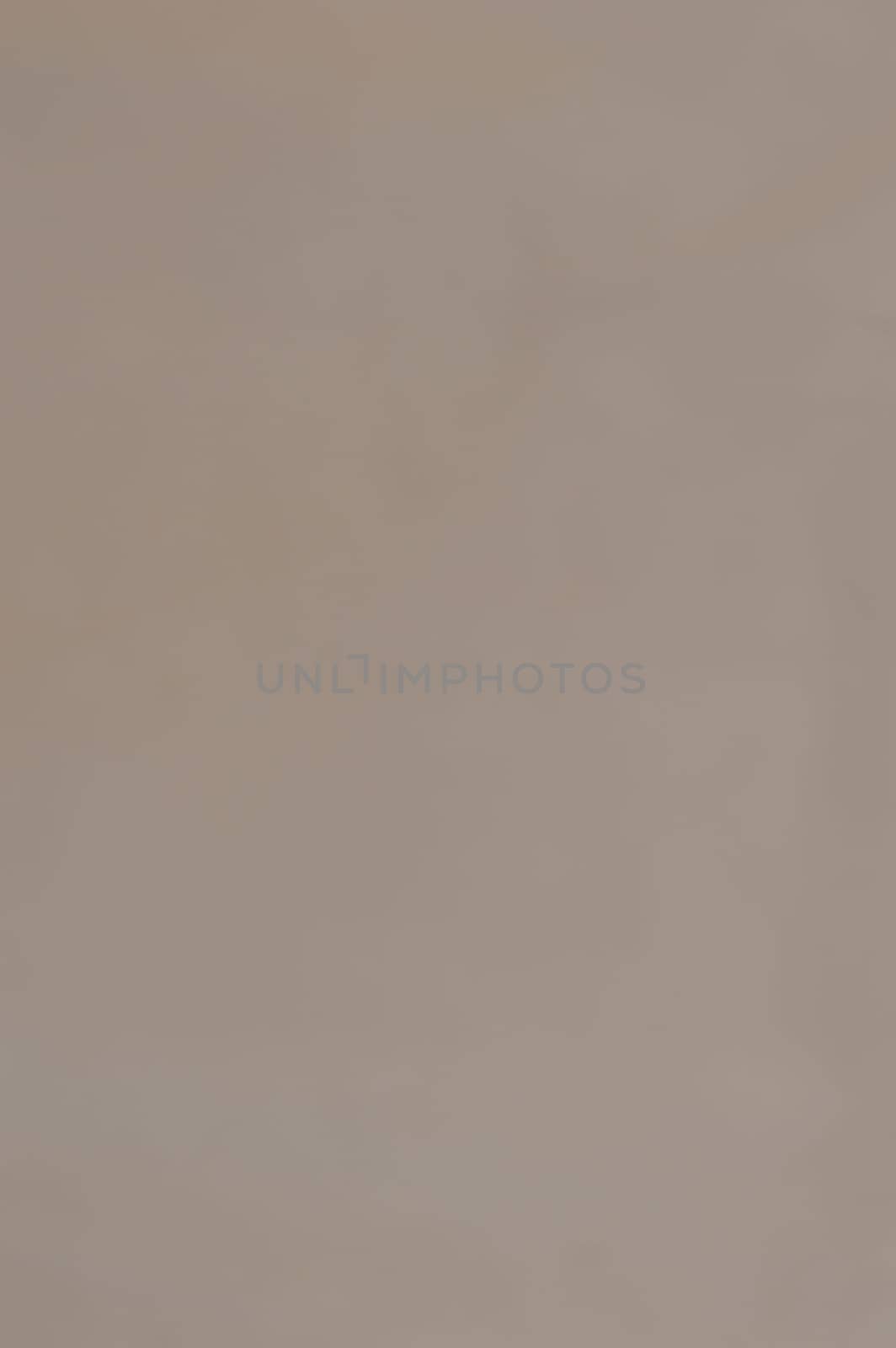 Brown color wrapping paper sheet abstract vertical background. Full frame. Copy Space.