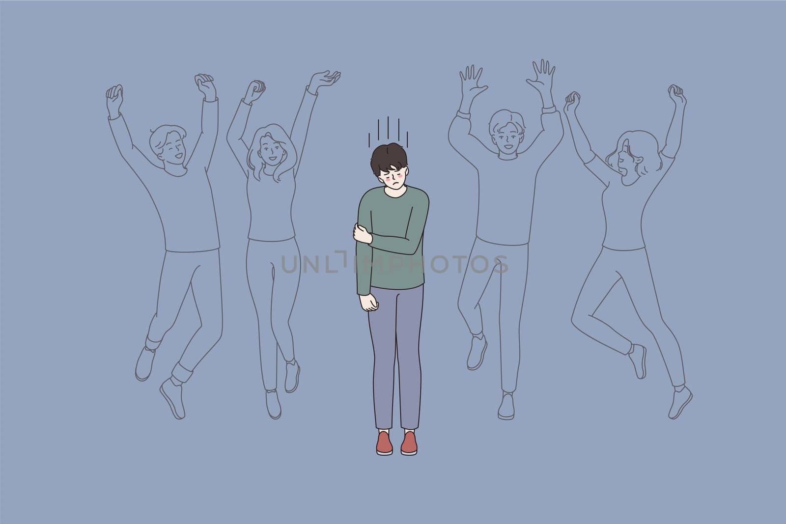 Loneliness in society and crowd concept. Upset young lonely man cartoon character standing alone among human crowd feeling alone lost vector illustration