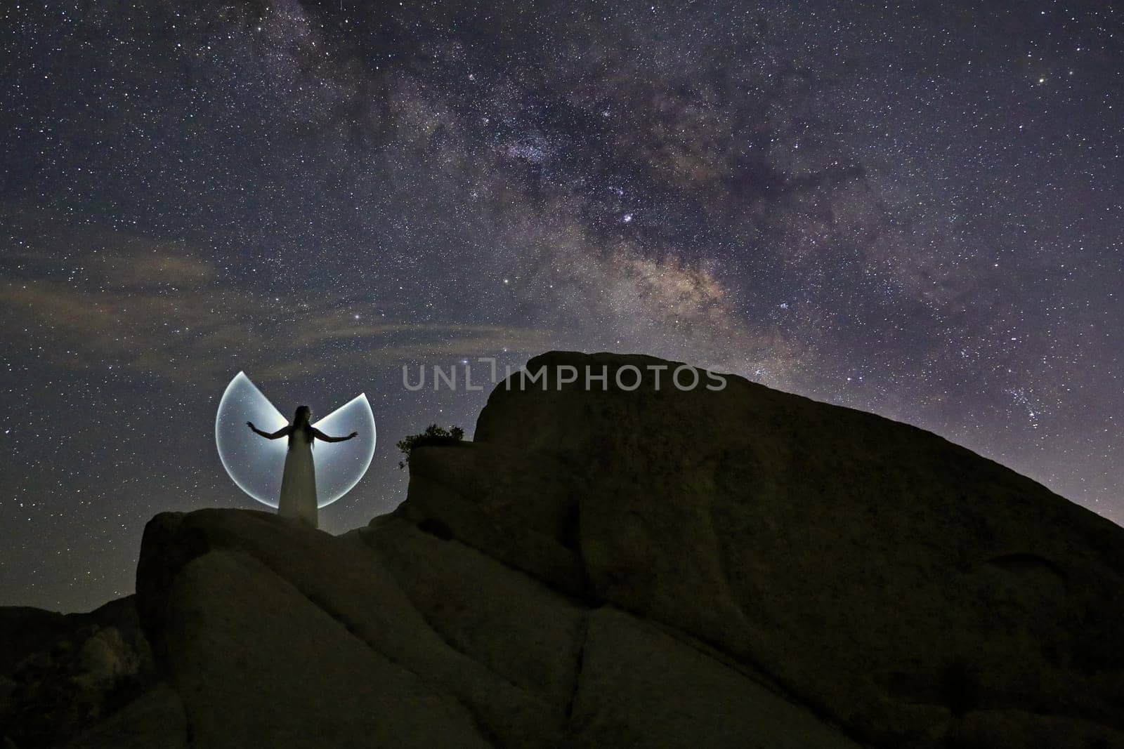 Woman Light Painted with the Night Sky Posing