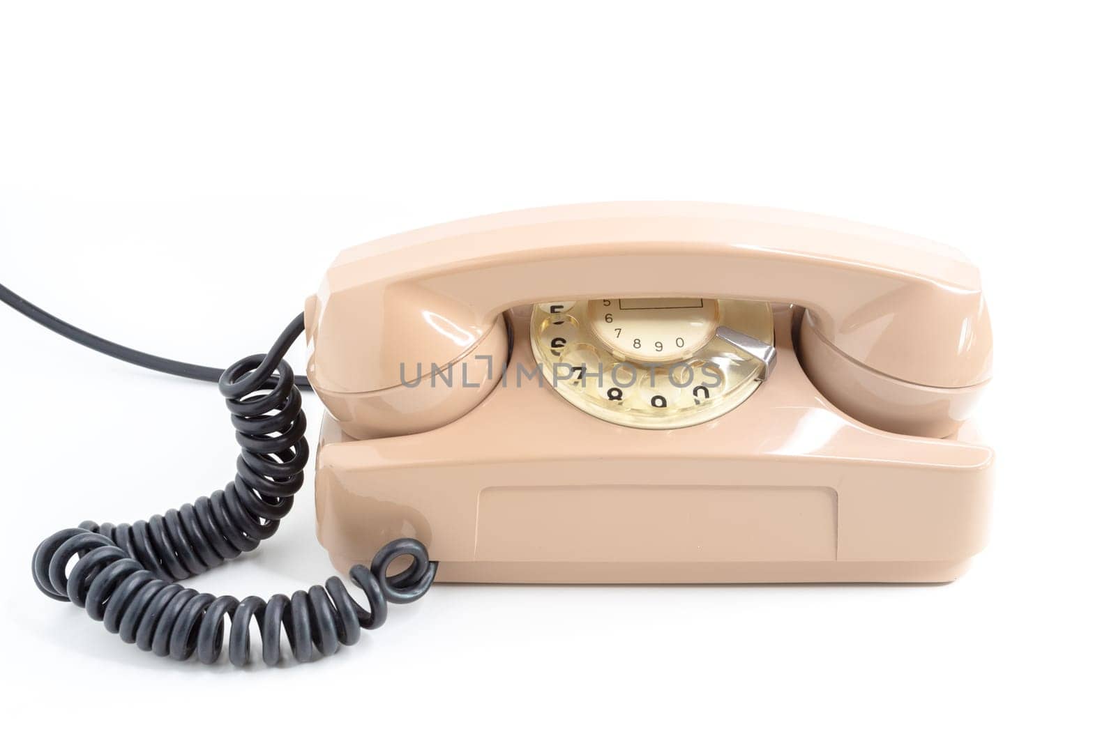 Vintage telephone. Pink old telephone isolated on white background.