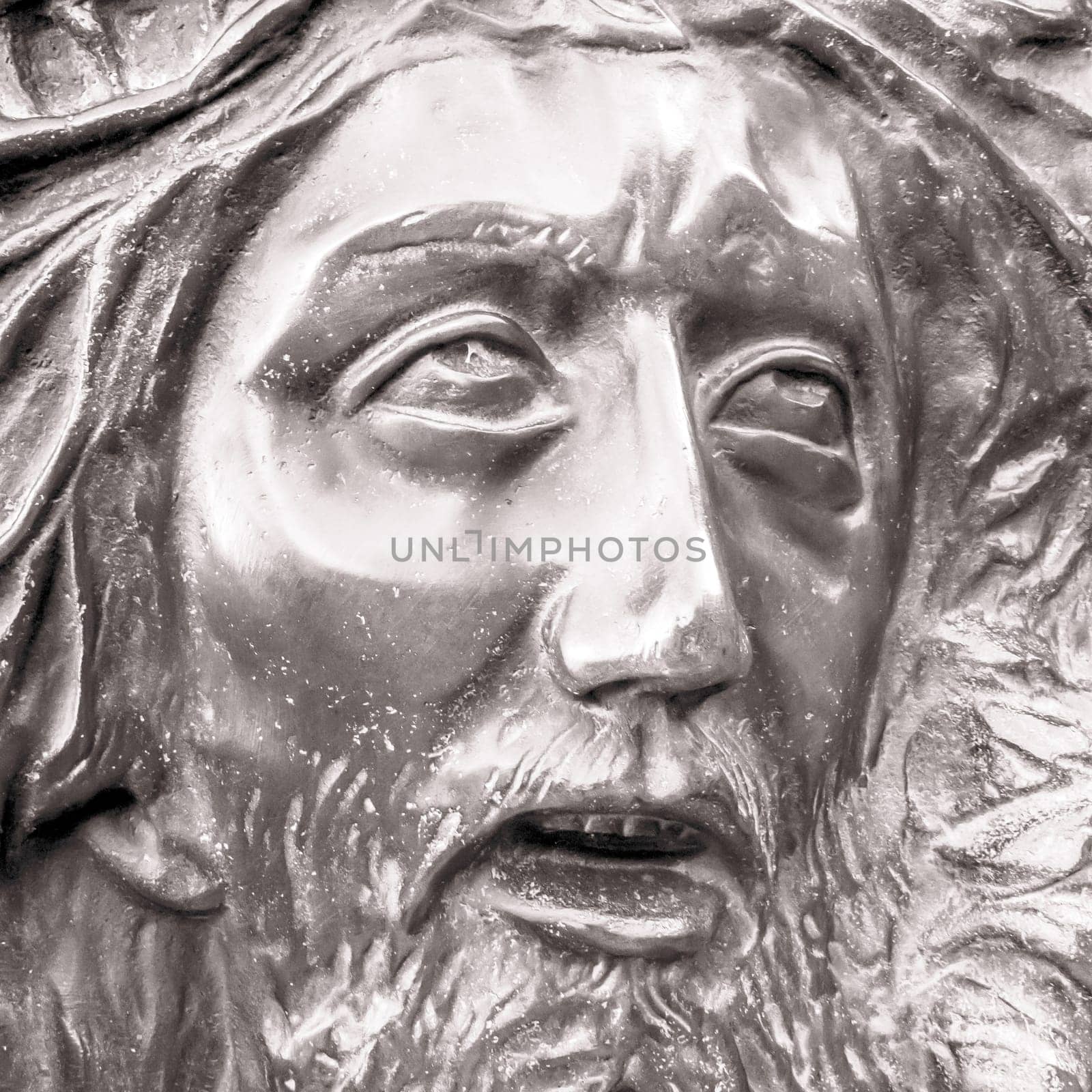 Bas-relief of Jesus crowned with thorns. High relief face of Jesus Christ with crown of thorns.