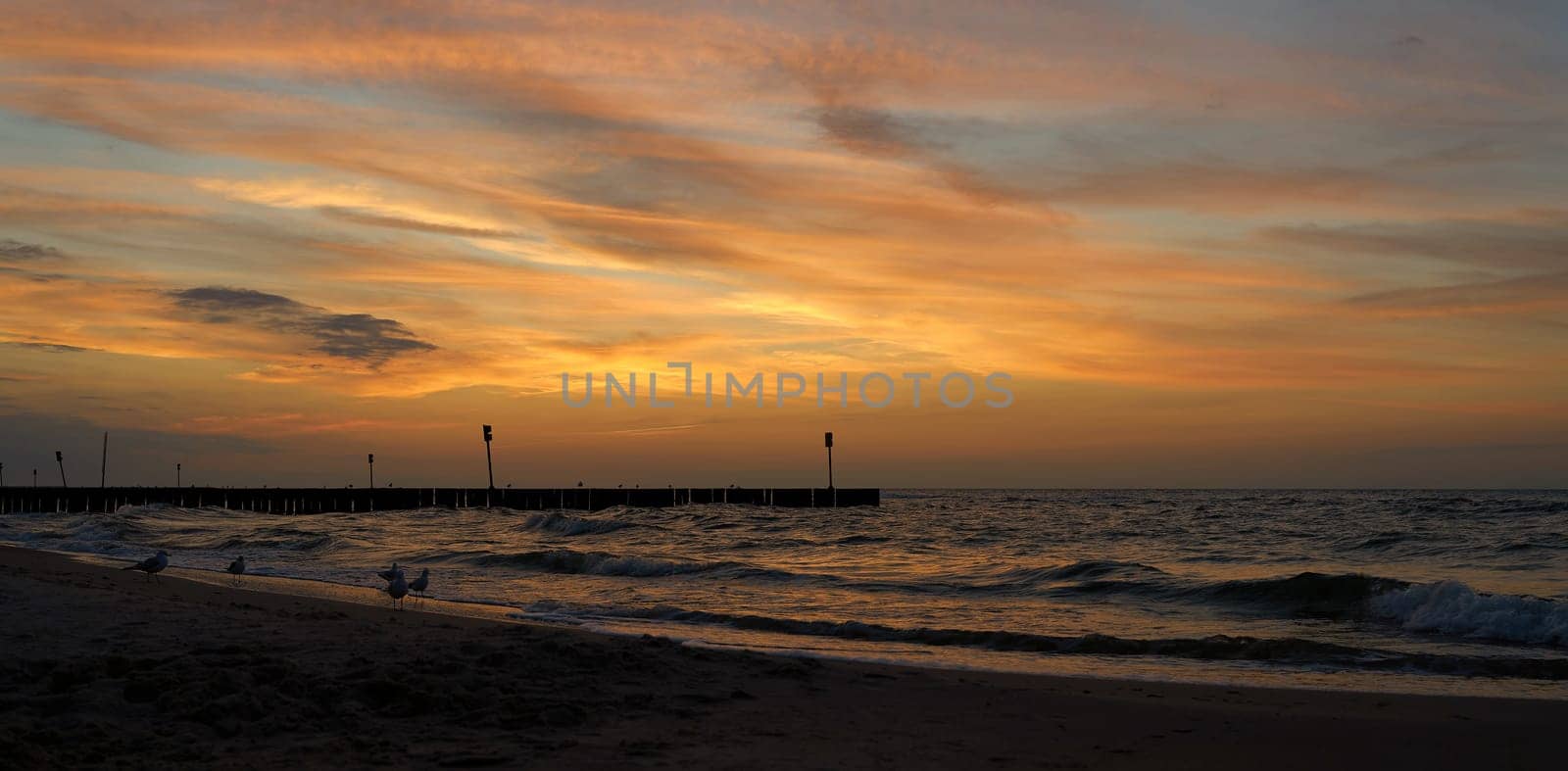 Evening atmosphere on the beach of the Polish Baltic coast near Kolobrzeg after sunset