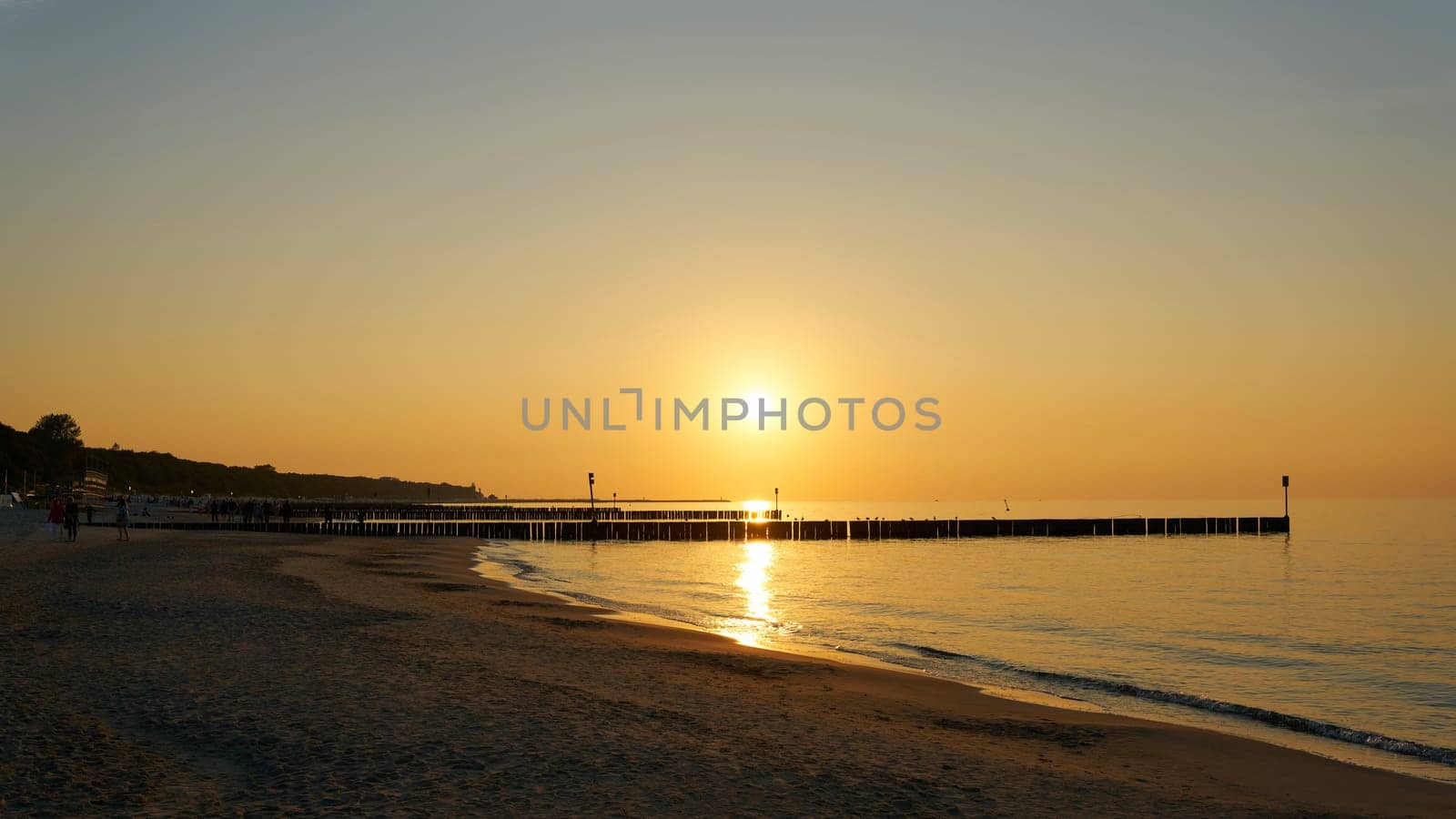 Evening atmosphere on the beach of the Polish Baltic coast near Kolobrzeg in the evening just before sunset