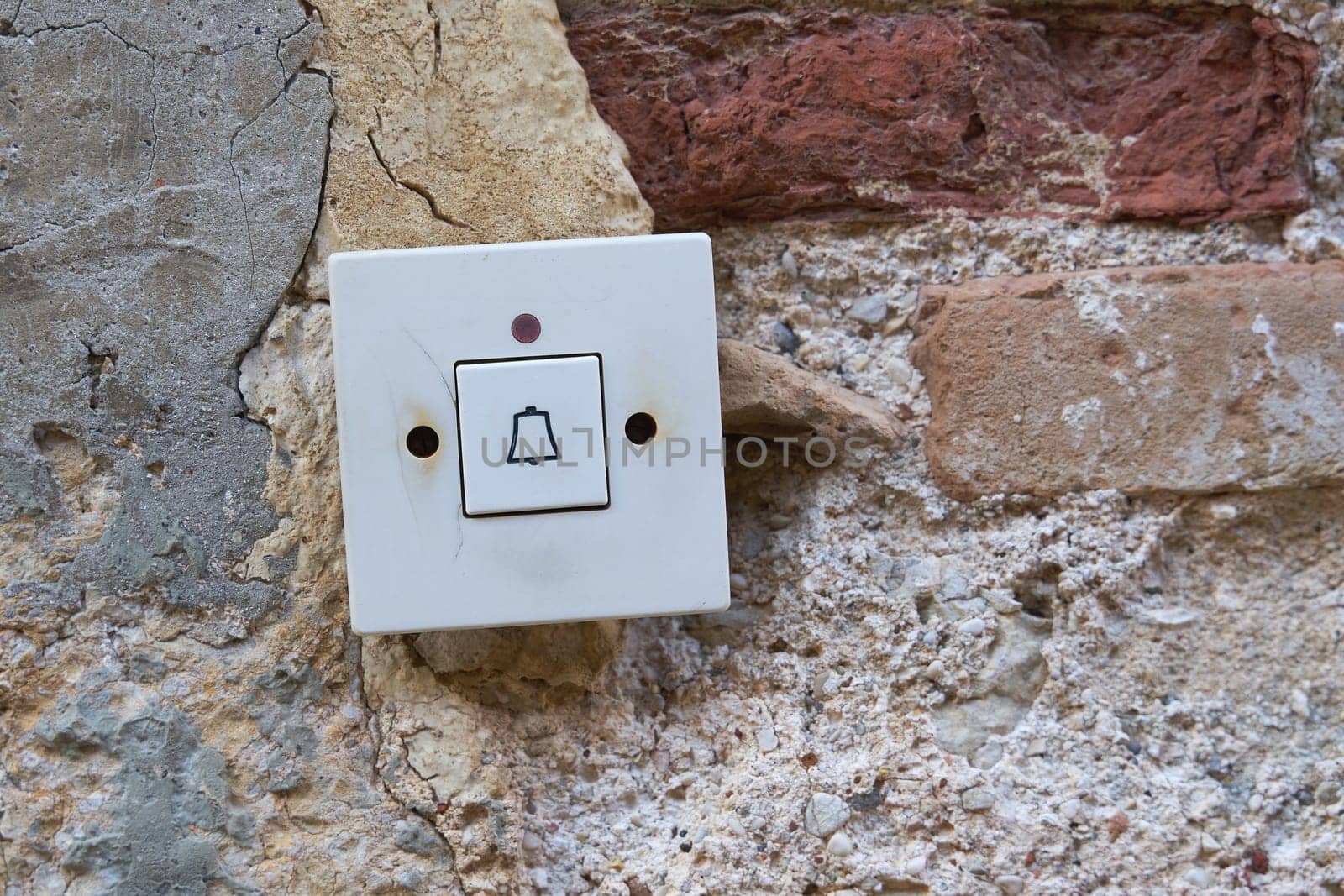 old bell button at the entrance of an old house in the old town of Krk in Croatia