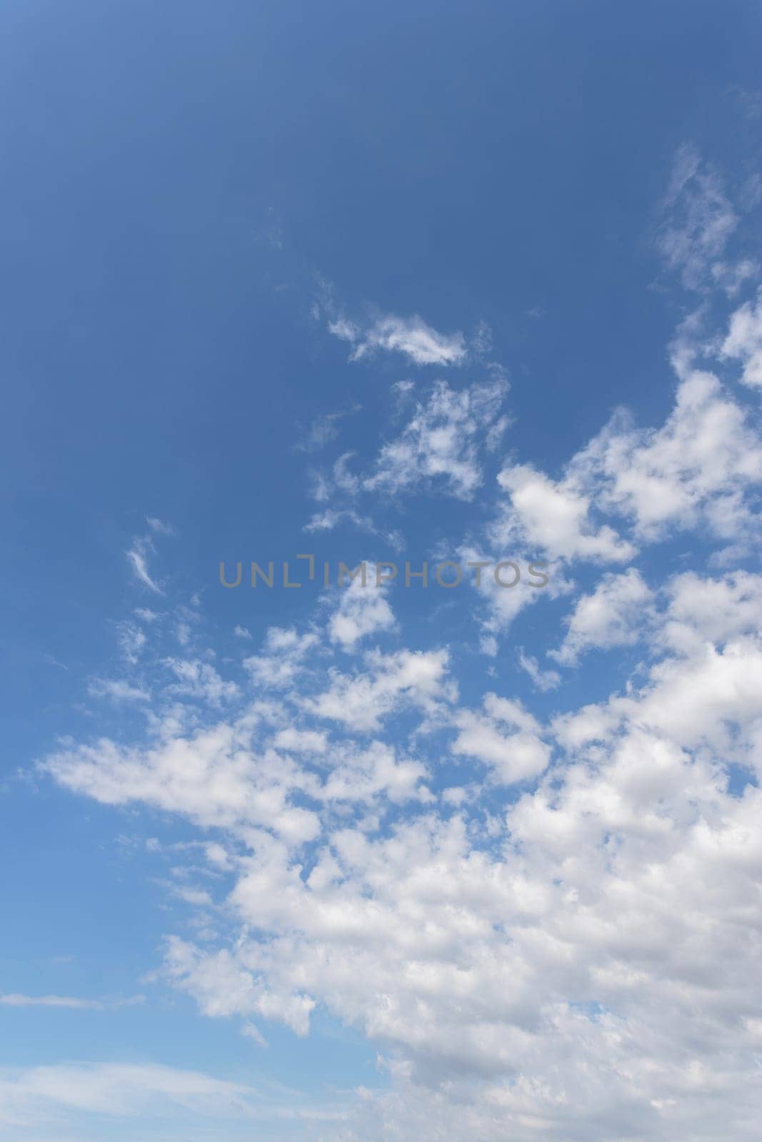 White and gray clouds with blue sky background.
