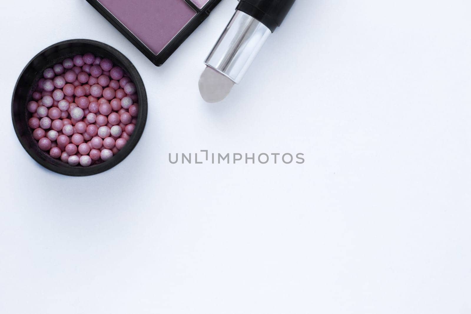 Chocolate-colored bronzer, blush balls and concealer background with space for text. top view, flat lay, copy space, isolate. High quality photo