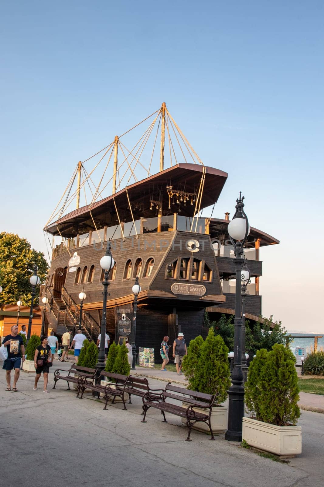 Golden Sands, Bulgaria - SEP 11, 2021. A view of the pirate ship Black Pearl Restaurant on Paradise Beach. The resort is a popular summer destination on the Black Sea coast near the city of Varna.