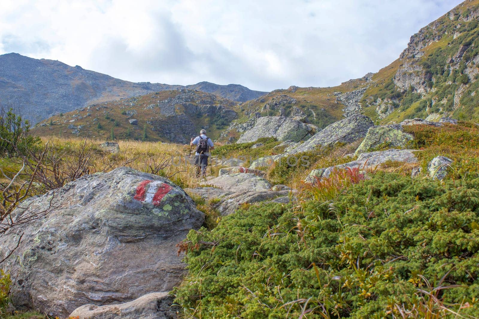 man trekking in the mountains, Alps in Austria, Steiermark
