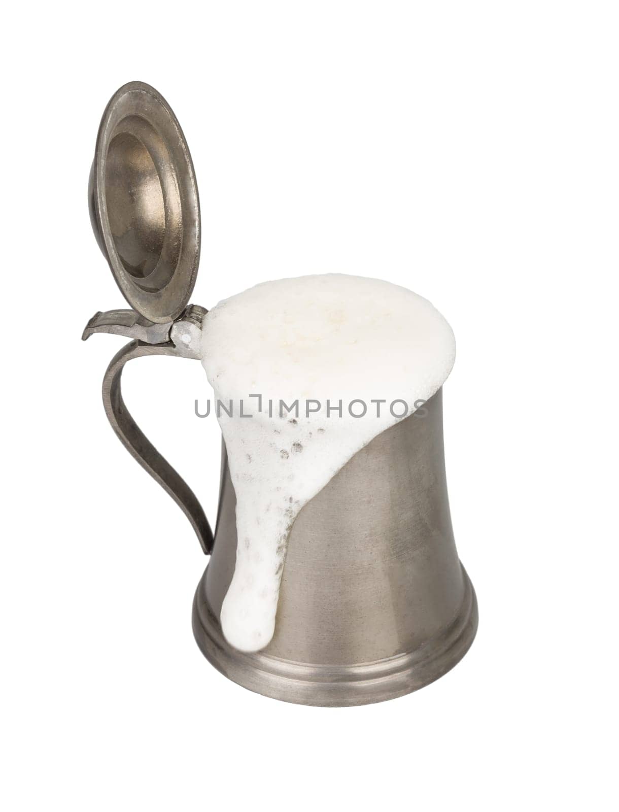 Metallic beer mug with beer isolated on white
