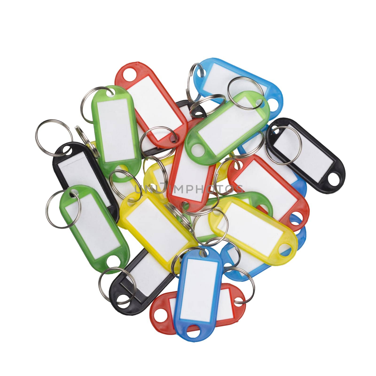 Pile of plastic key tags of various colors isolated on white.