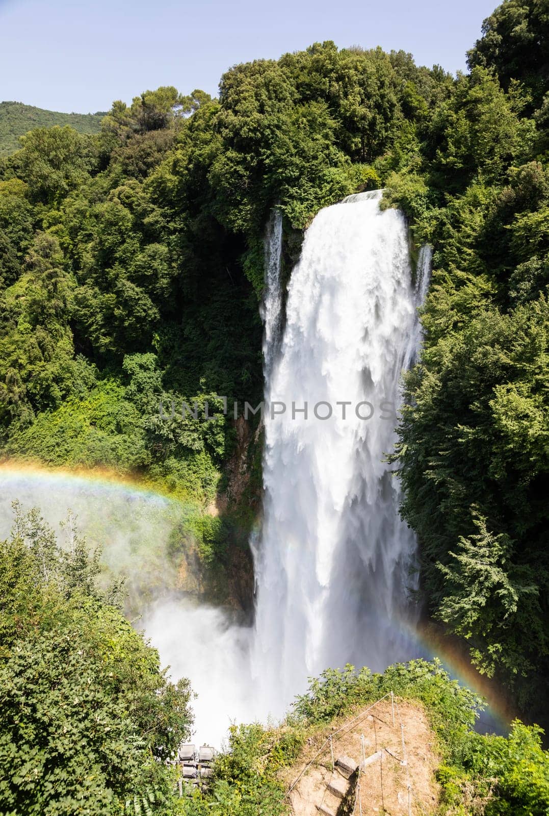 Marmore waterfall in Umbria region, Italy. Amazing cascade splashing into nature with trees and rocks.