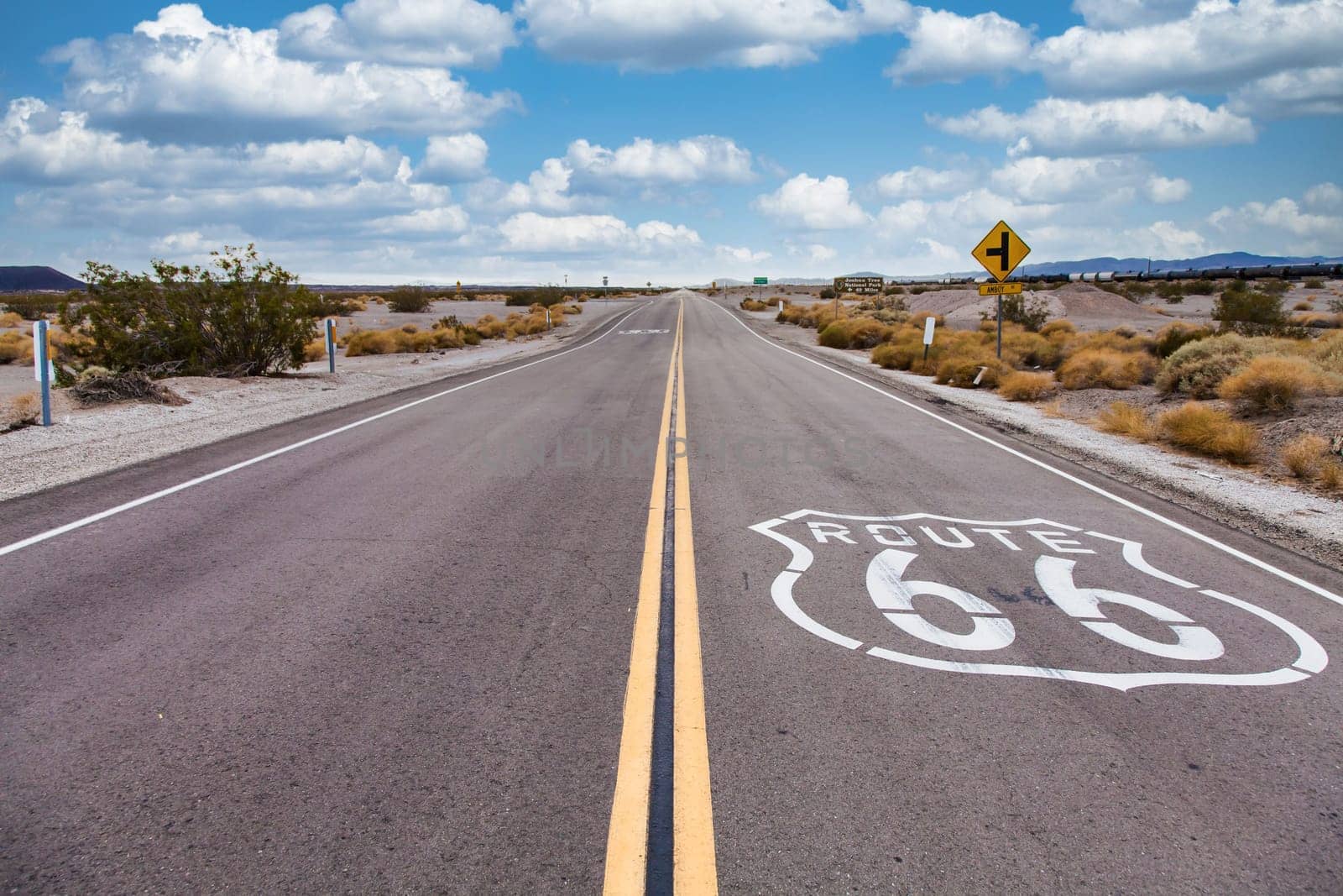 Route 66 in the desert with scenic sky. Classic vintage image with nobody.