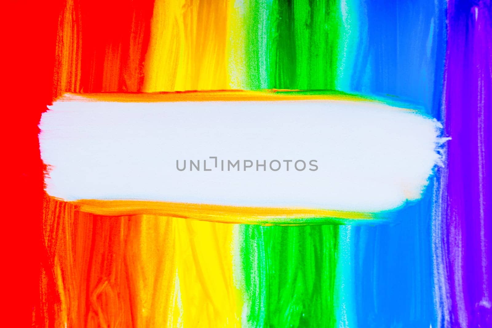 Colorful lines drawn vertically with paint in the form of a rainbow with a white place for text in the middle on a white background. top view, flat lay, copy space, isolate. High quality photo