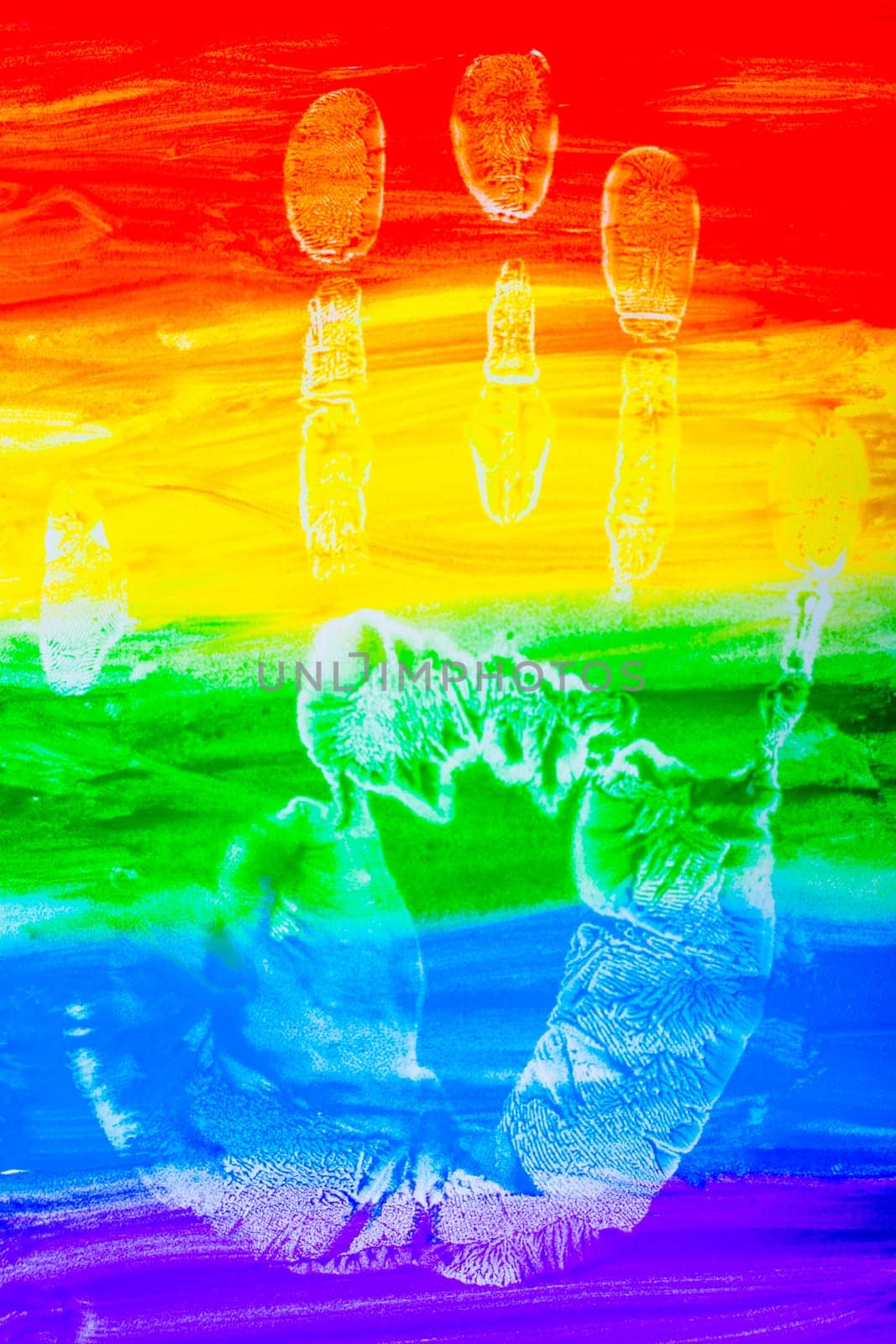 Colorful lines drawn horizontally with paint in the form of a rainbow with a handprint on a white background. LGBT PEOPLE. top view, flat lay, copy space, isolate. High quality photo