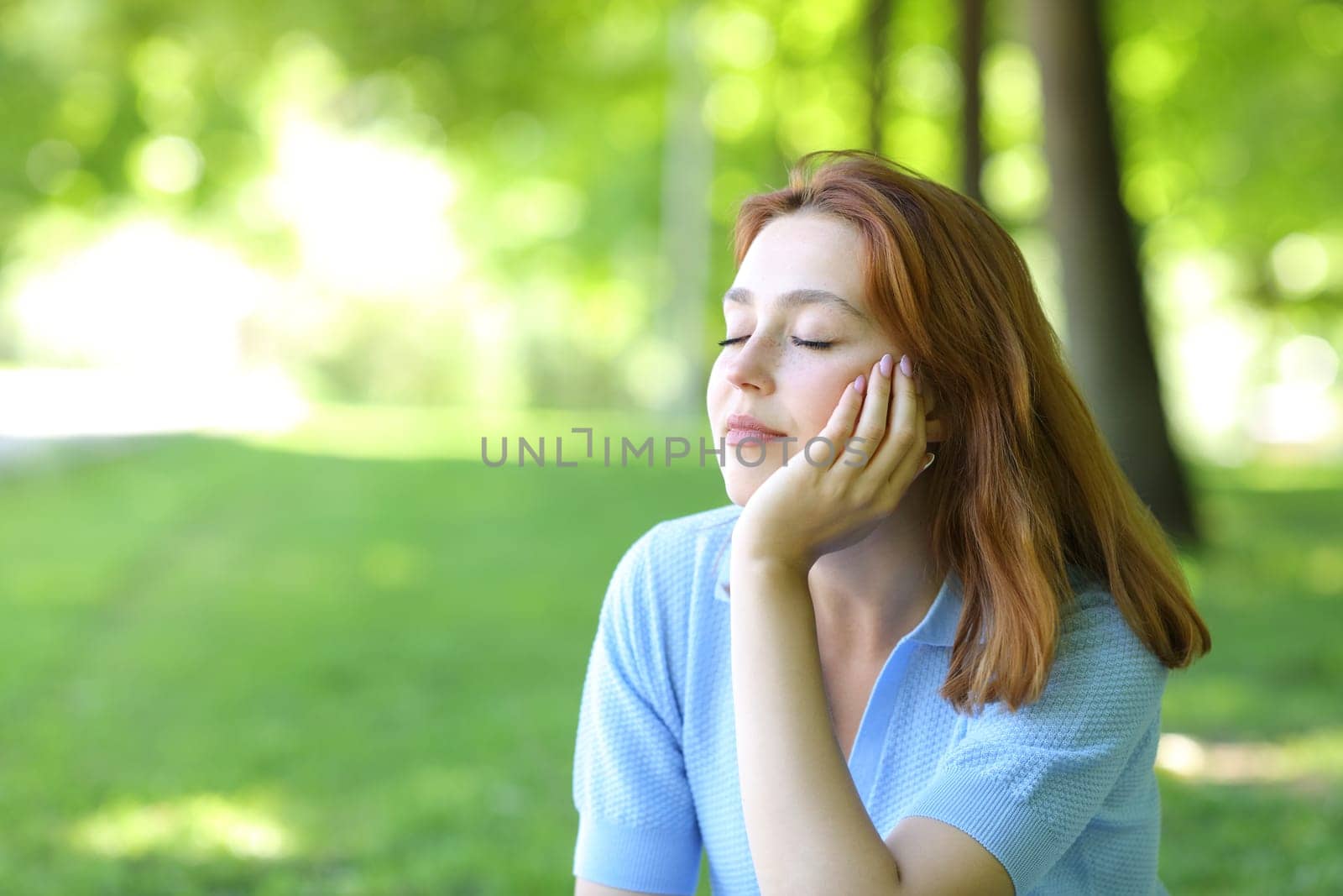 Beautiful woman relaxing sitting in a park