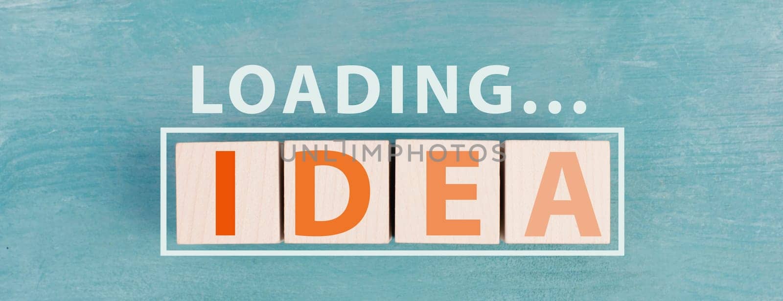The word idea is standing on wooden cubs in orange color,blue background, loading symbol