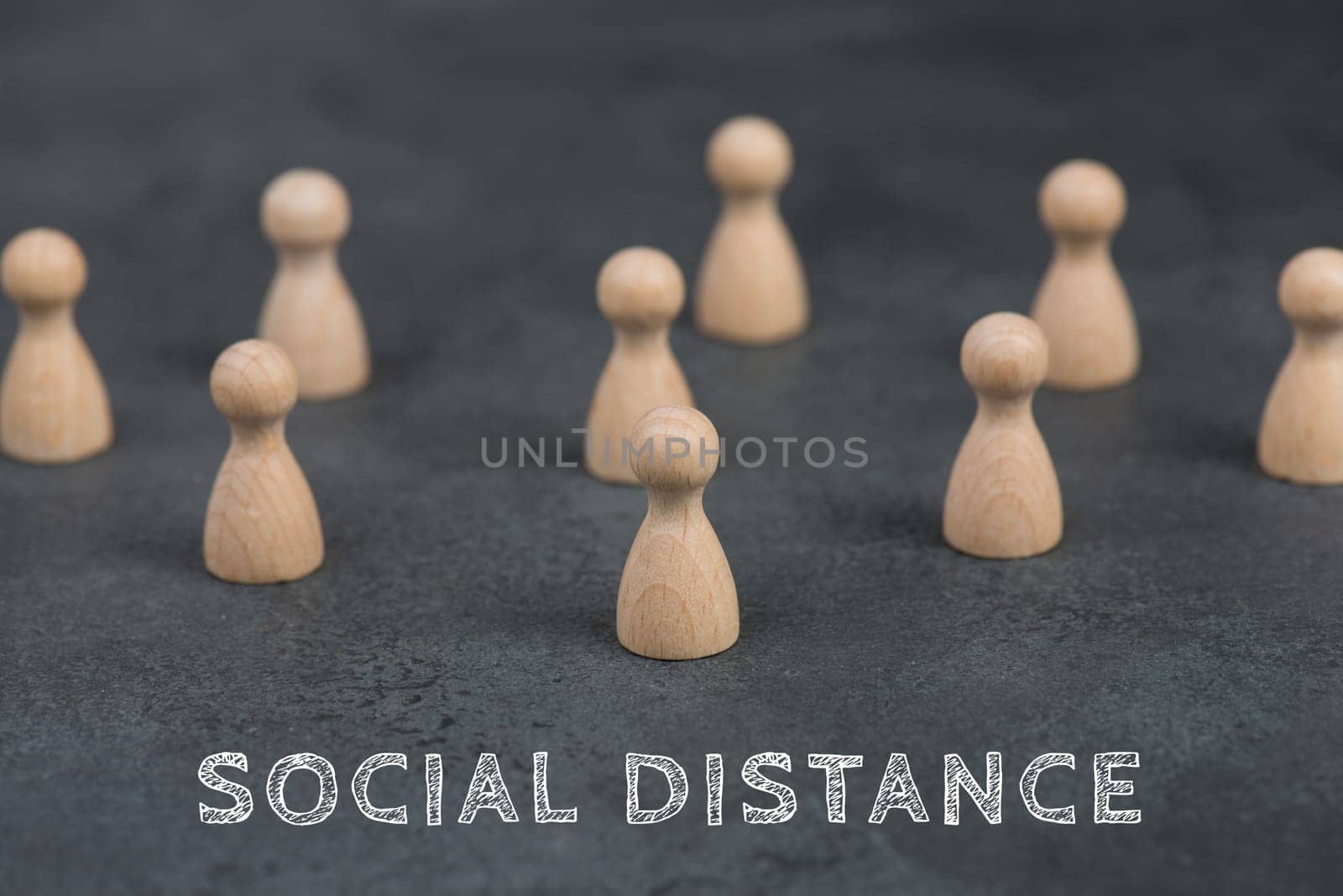 A group of woooden people keep social distance, Covid-19 pandemic regulations, dark background