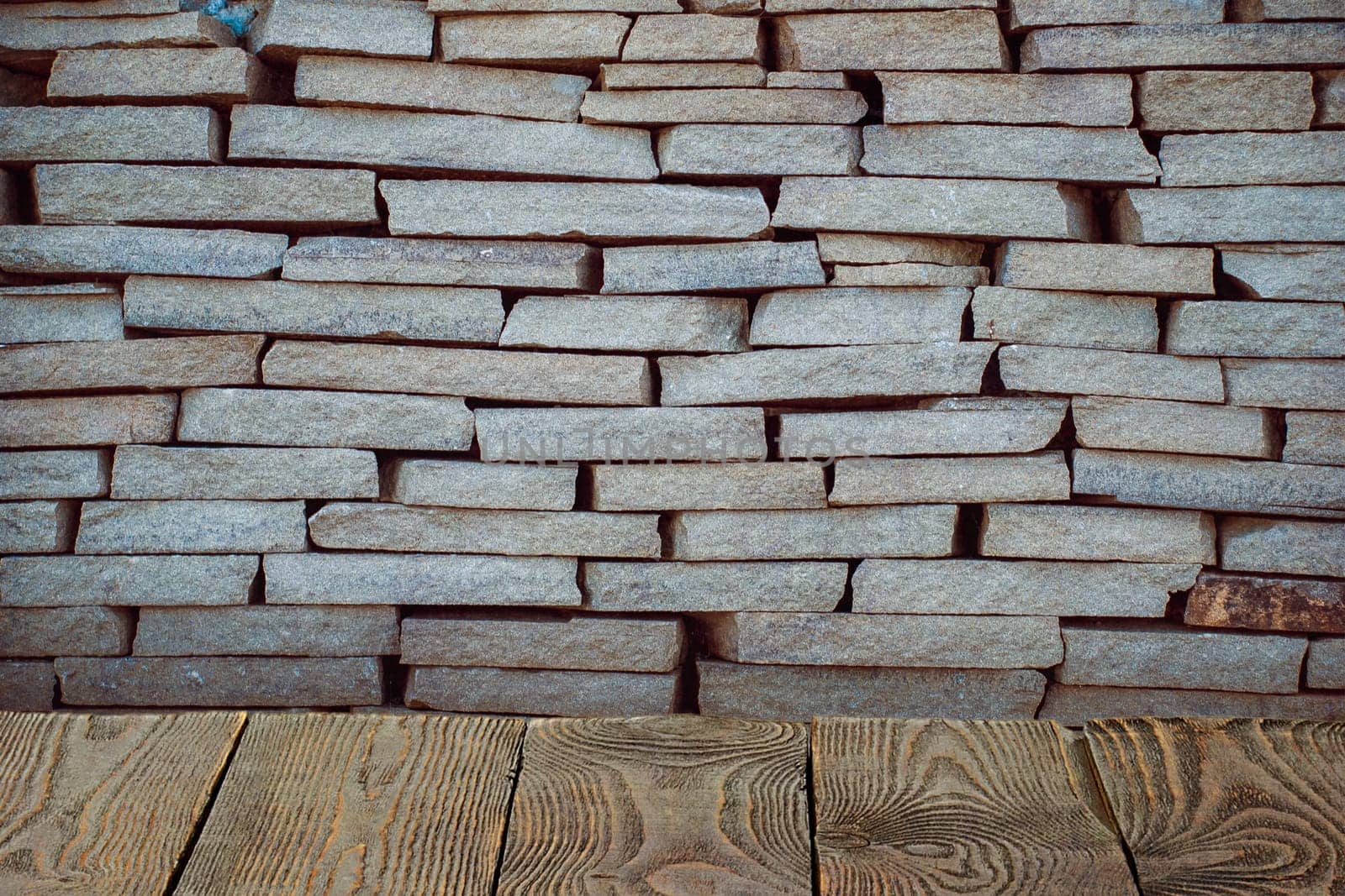 The background is blank wooden boards and a textured brick wall with lighting and vignetting. For product demonstrations, free space, layout, mockup, perspective board, background board.