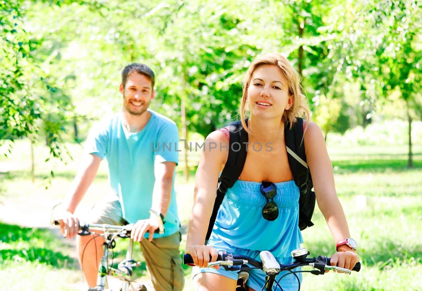 Young man and woman having a bike ride in nature