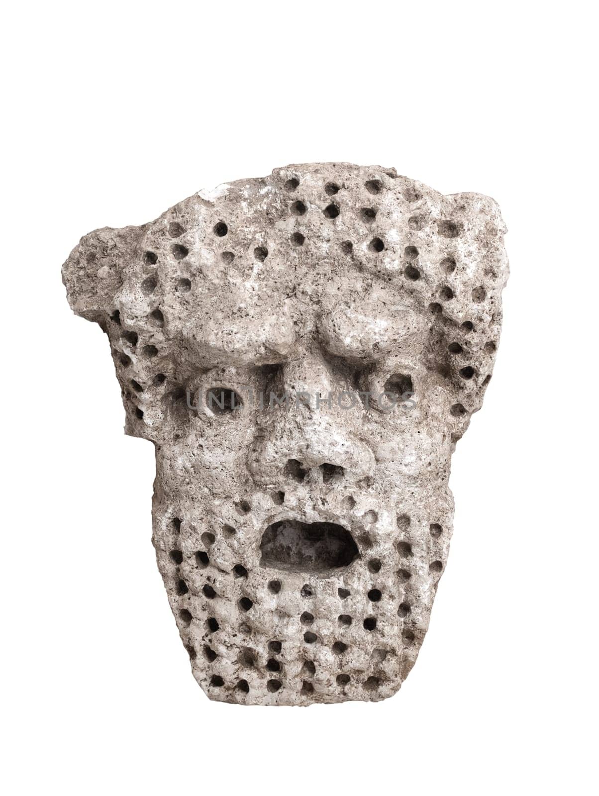 antique male demon stone statue head with open mouth and holes in hair and beard isolated on white background