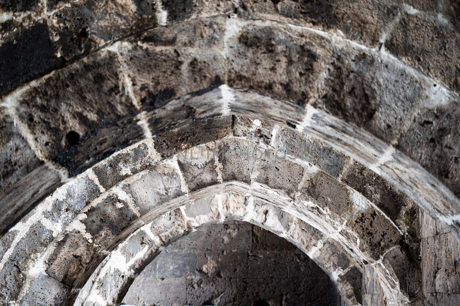 perspective view closeup of stone arcades in a medieval castle hallway