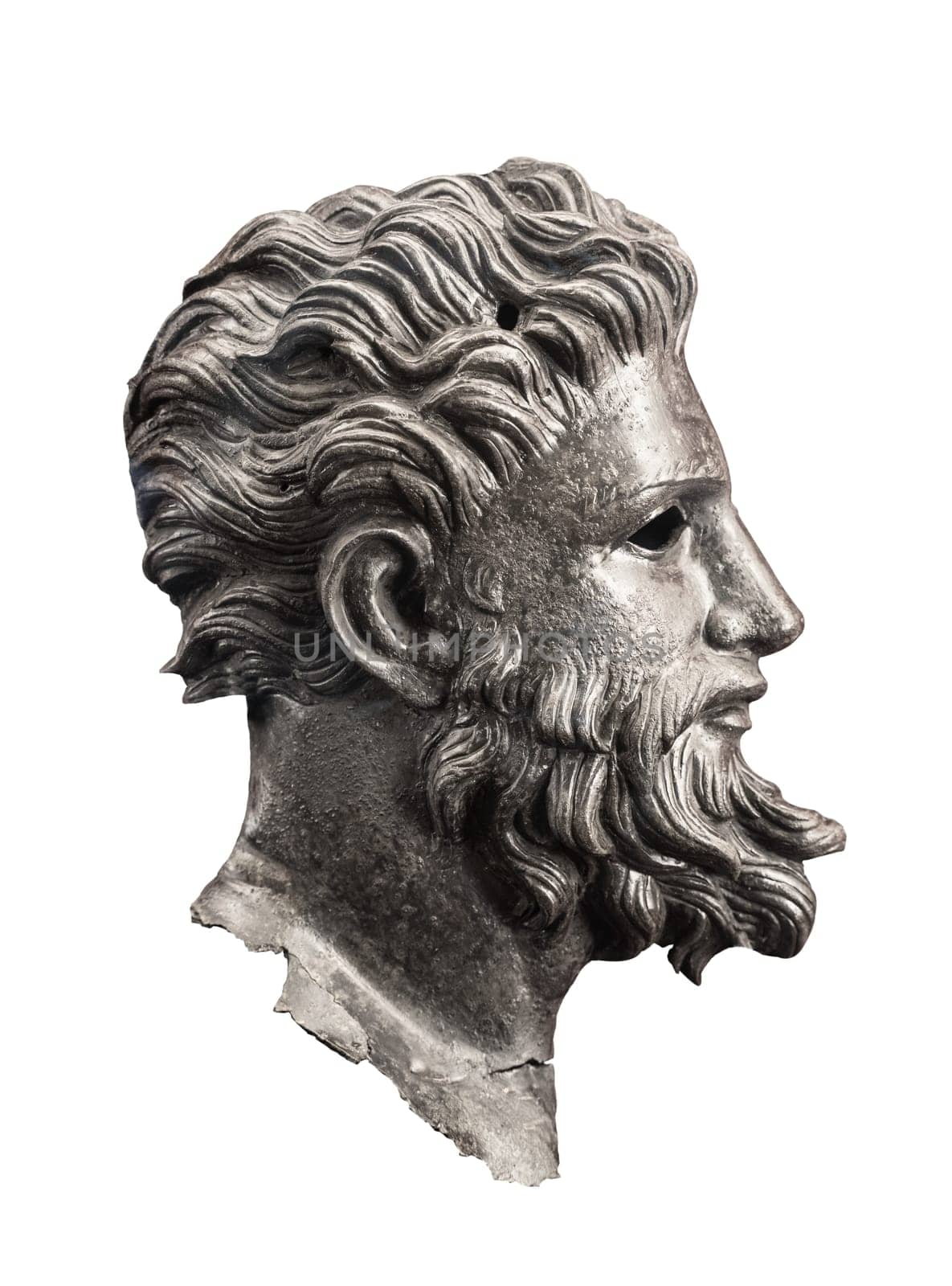 front view closeup of ancient dark metallic basorelief of handsome man with beard looking forward isolated on white background