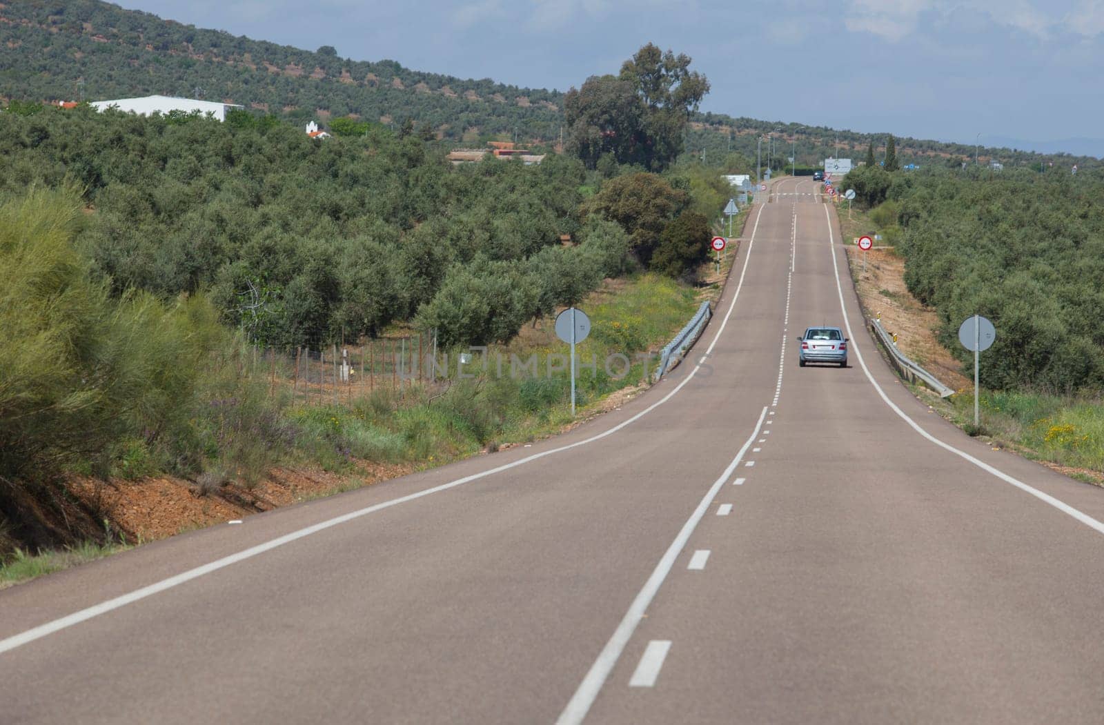 Local road full of change of slopes or gradient changes. Driving along La Serena, Extremaduran southeast, Spain