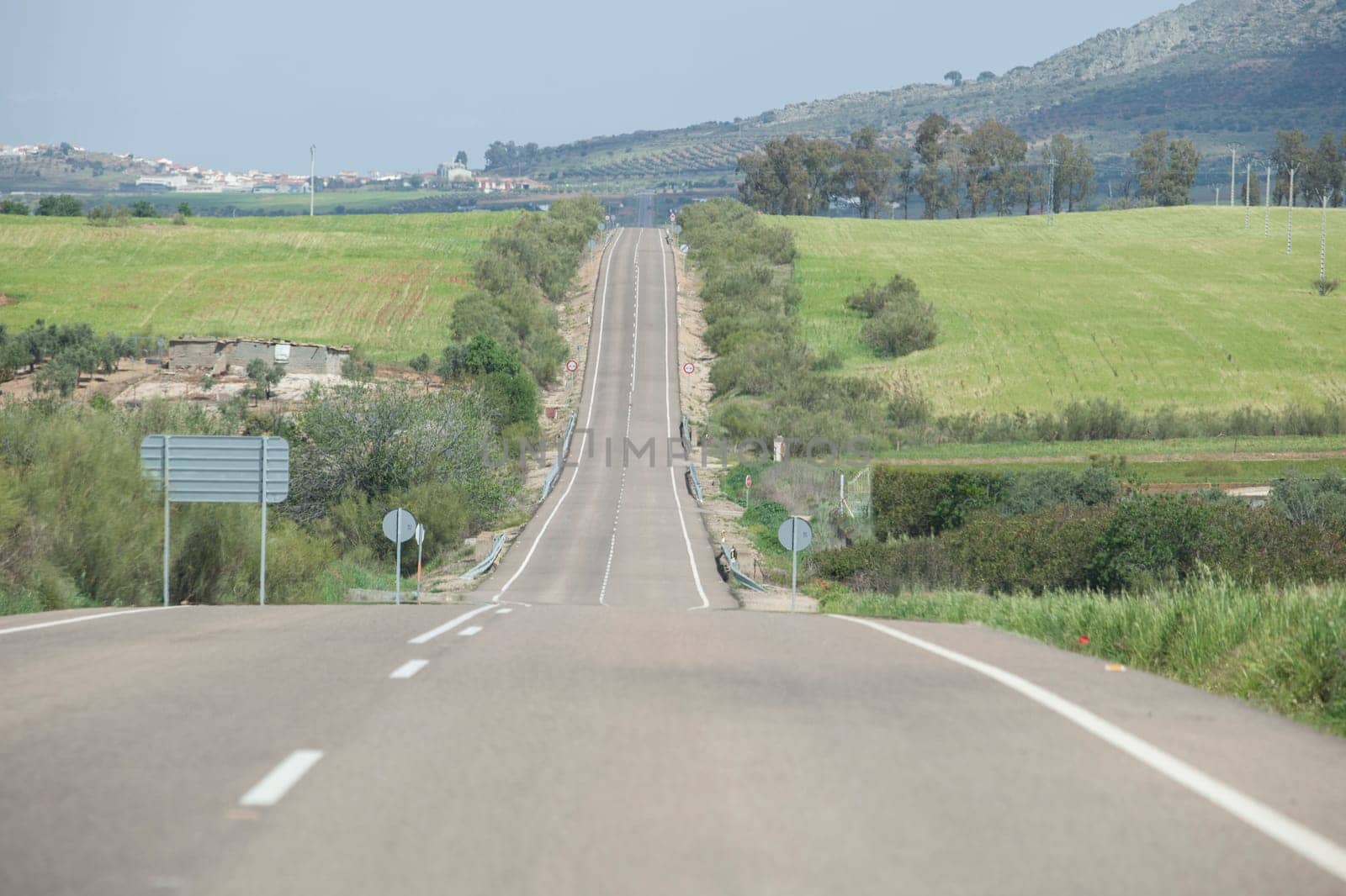 Local road full of change of slopes or gradient changes. Driving along La Serena, Extremaduran southeast, Spain