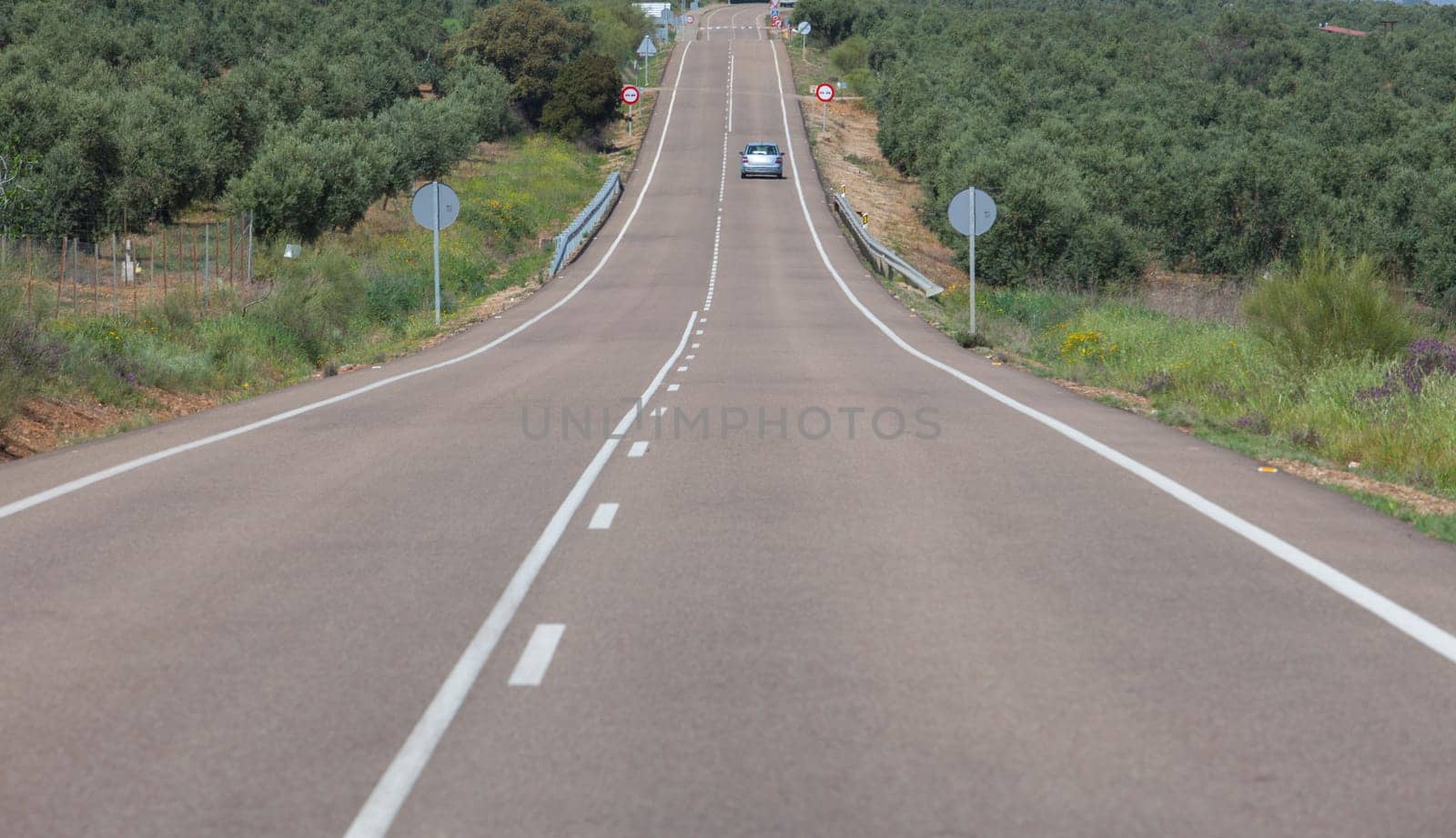Local road full of change of slopes or gradient changes. Driving along La Serena, Extremaduran southeast, Spain