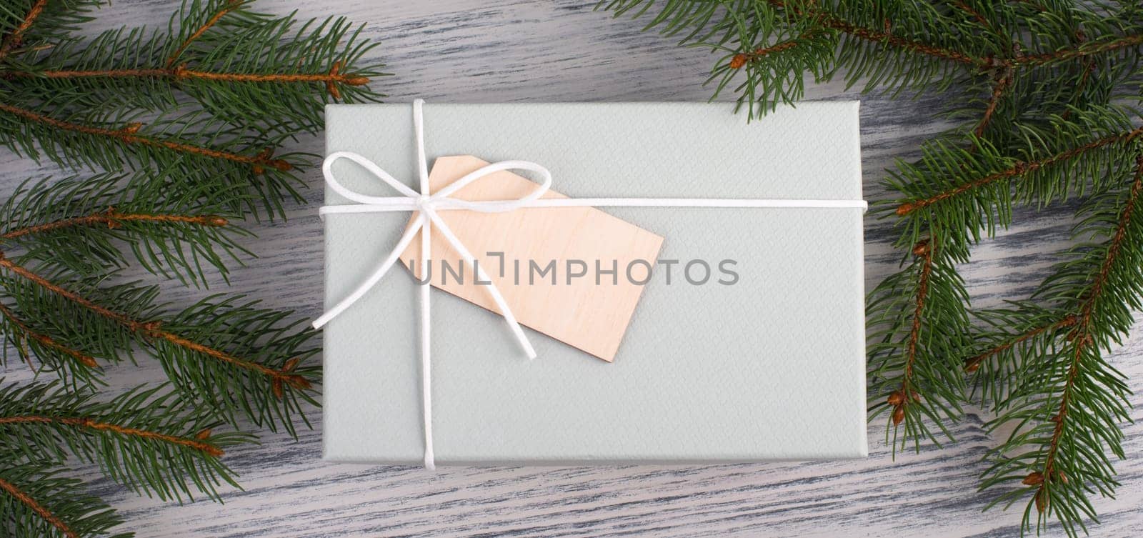 A gift parcel with christmas decoration, branch of fir, presents for the holiday, empty copy space
