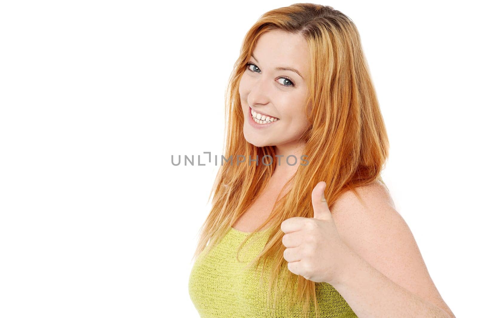 Sideways of woman making thumb up gesture
