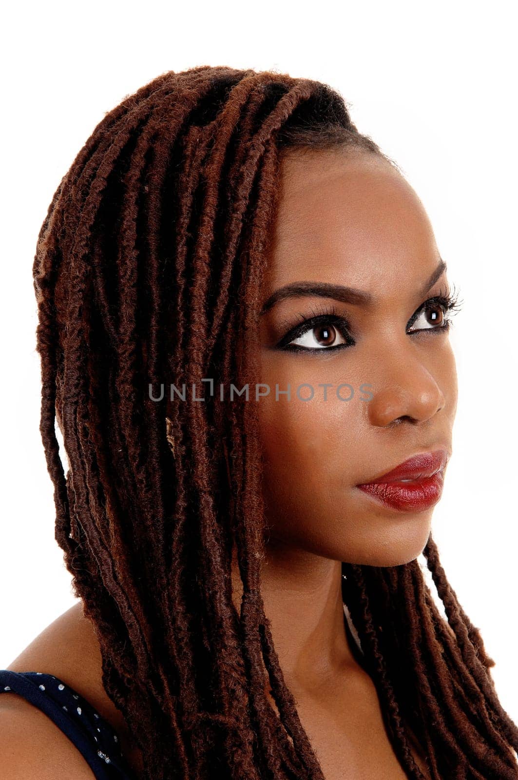 A very pretty young African American woman in profile closeup shoot, .looking away, isolated for white background..